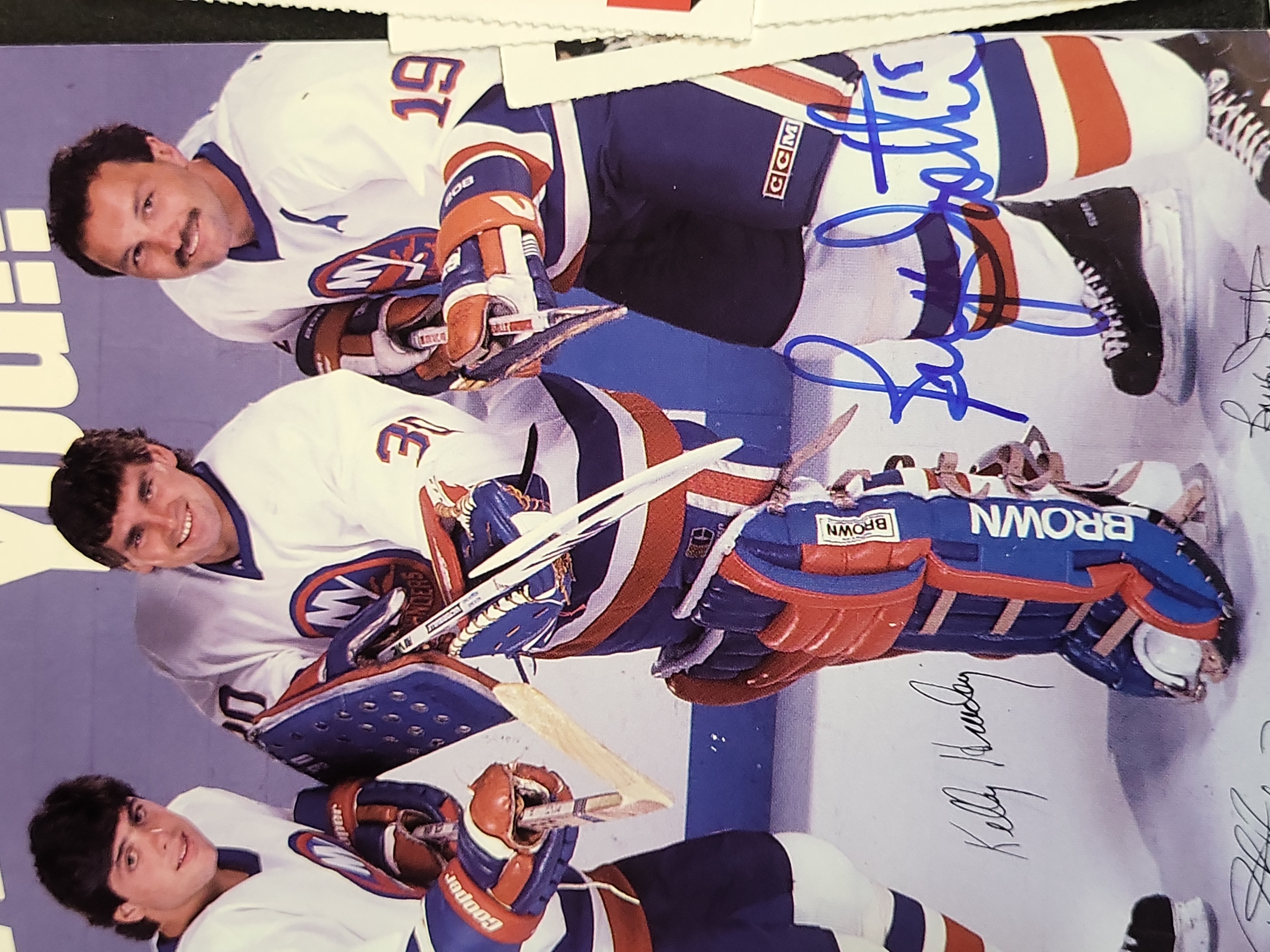 I03445 | A Collection of Professional Hockey Memorabilia Featuring Autographed Items and Trading Cards