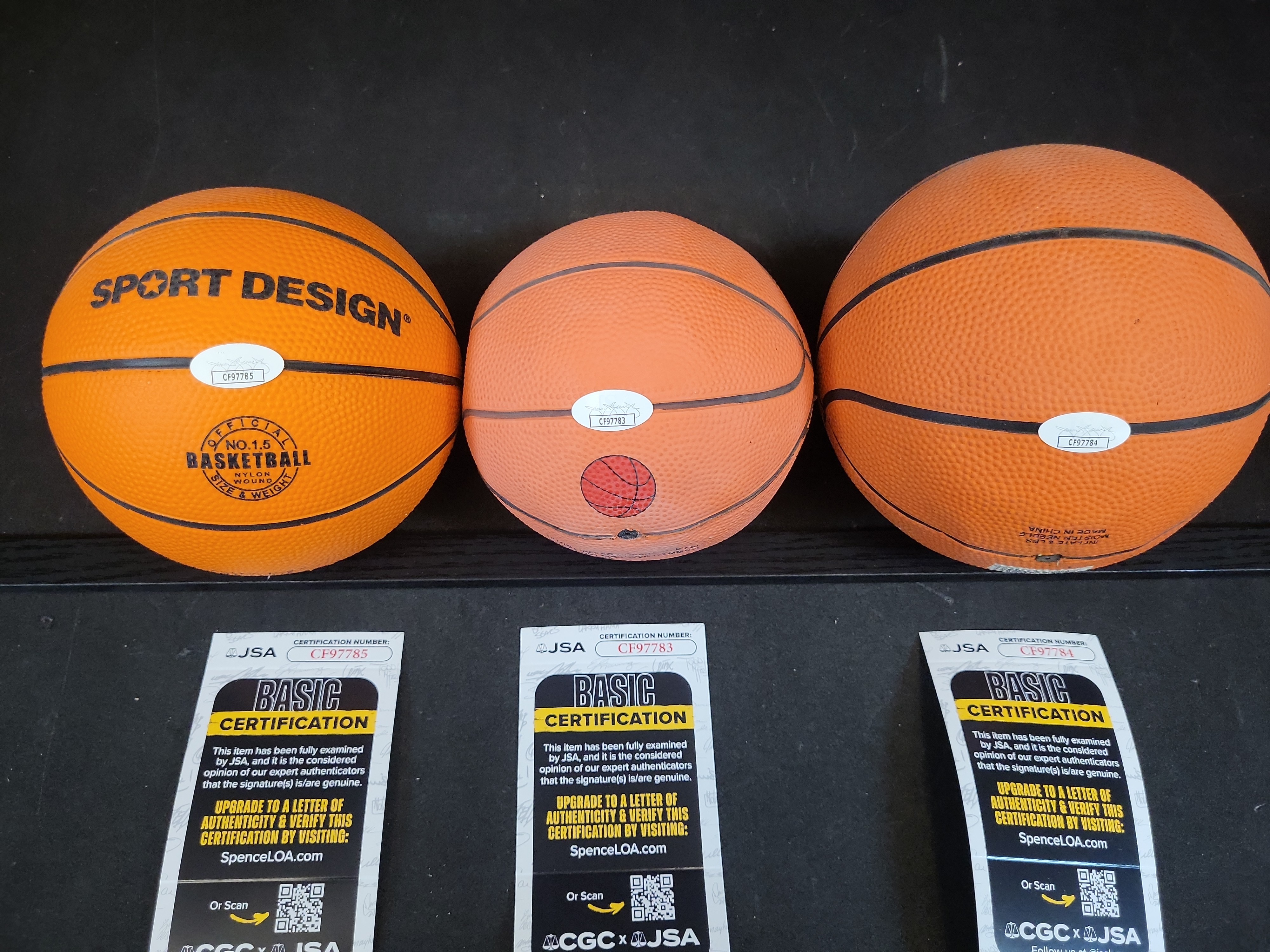 I03444 | A Trio of Autographed Basketball Legend Mini-Basketballs Including John Wooden, Bob Pettit, and Rick Barry with JSA COAs