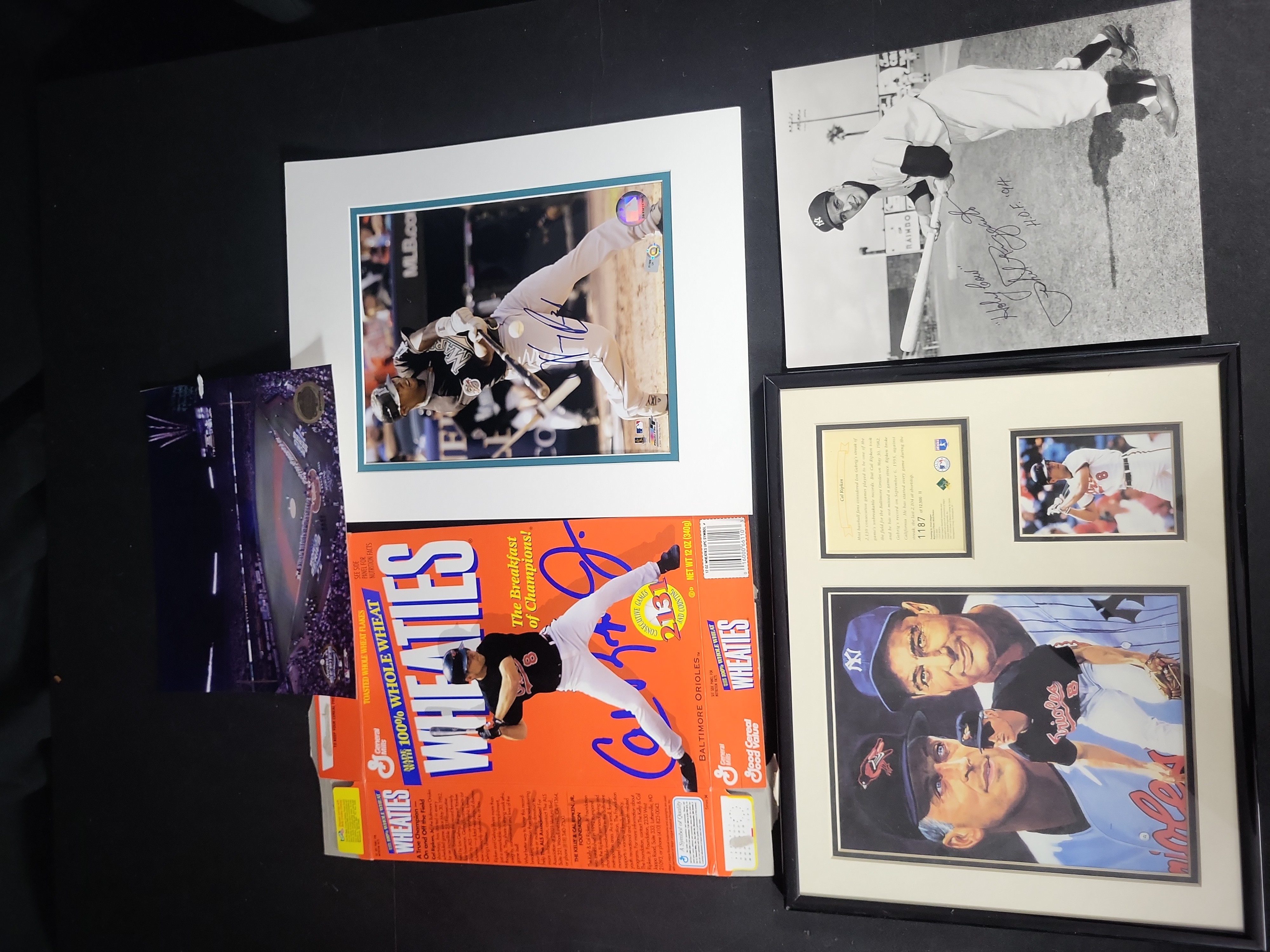 I03342 | A Collection of Baseball Memorabilia Including Autographed Photos and Cal Ripken Jr Collectibles