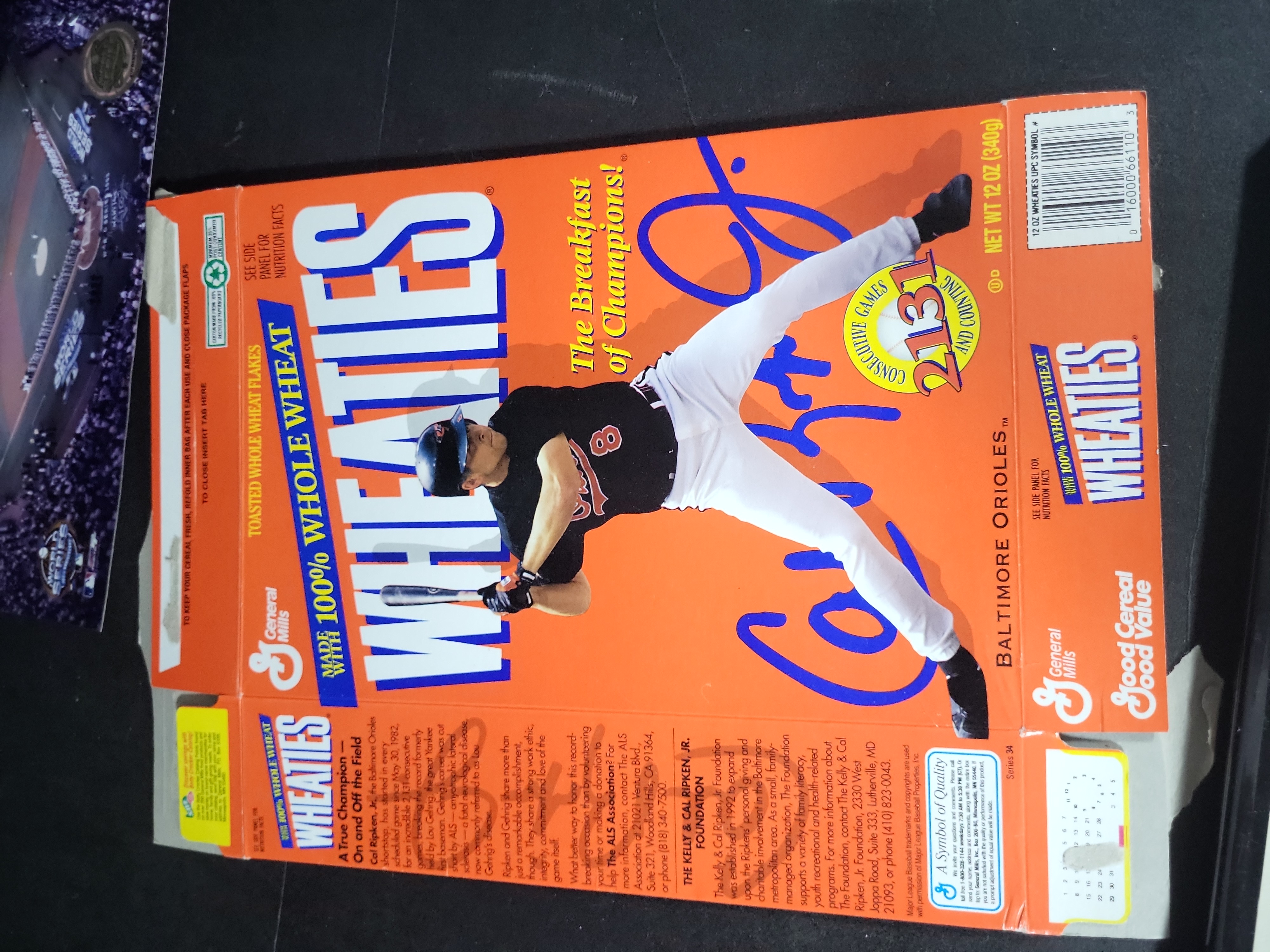 I03342 | A Collection of Baseball Memorabilia Including Autographed Photos and Cal Ripken Jr Collectibles