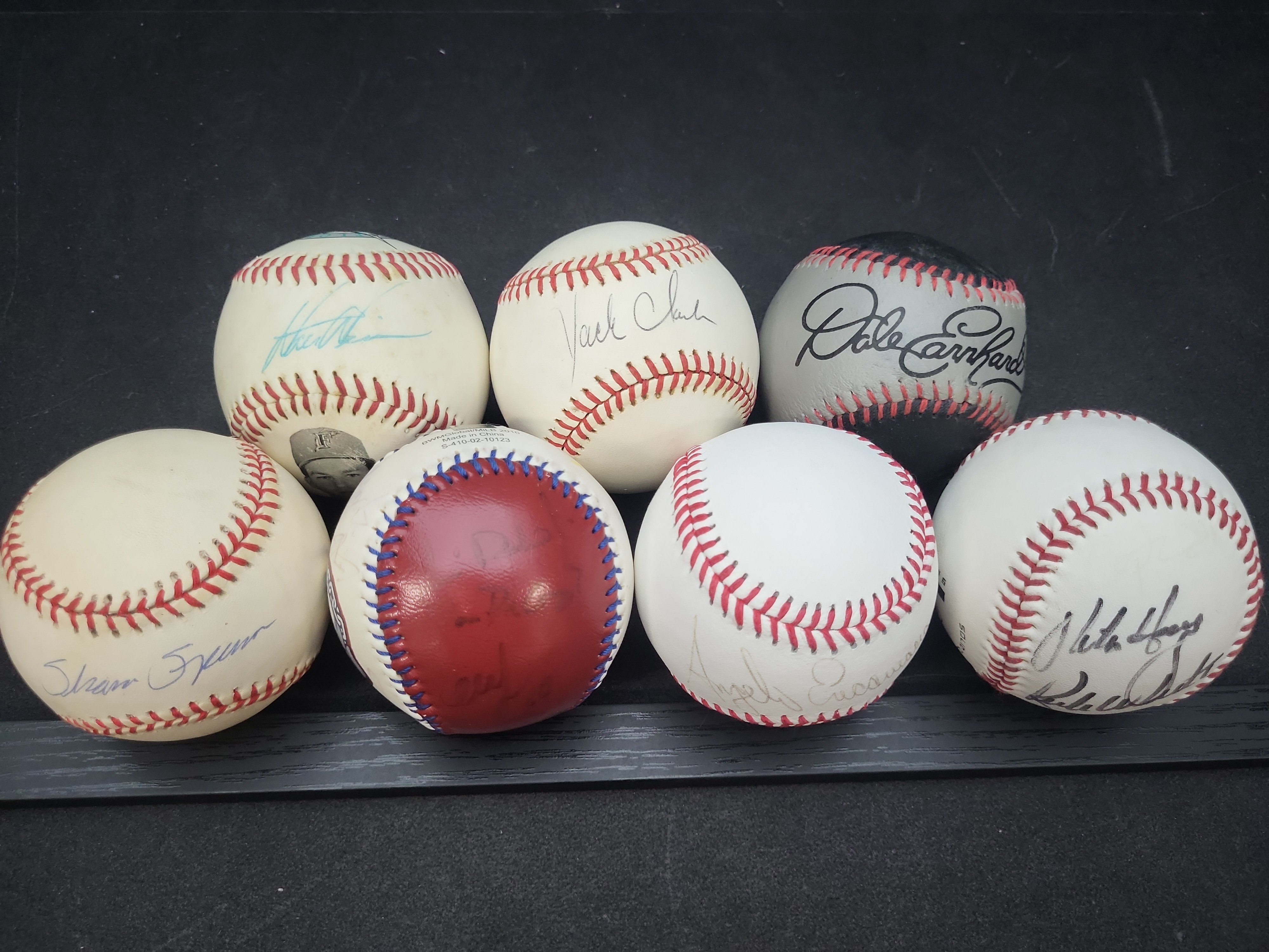 I03356 | A Collection of Seven Autographed and Novelty Baseballs Including Dale Earnhardt and Jack Clark