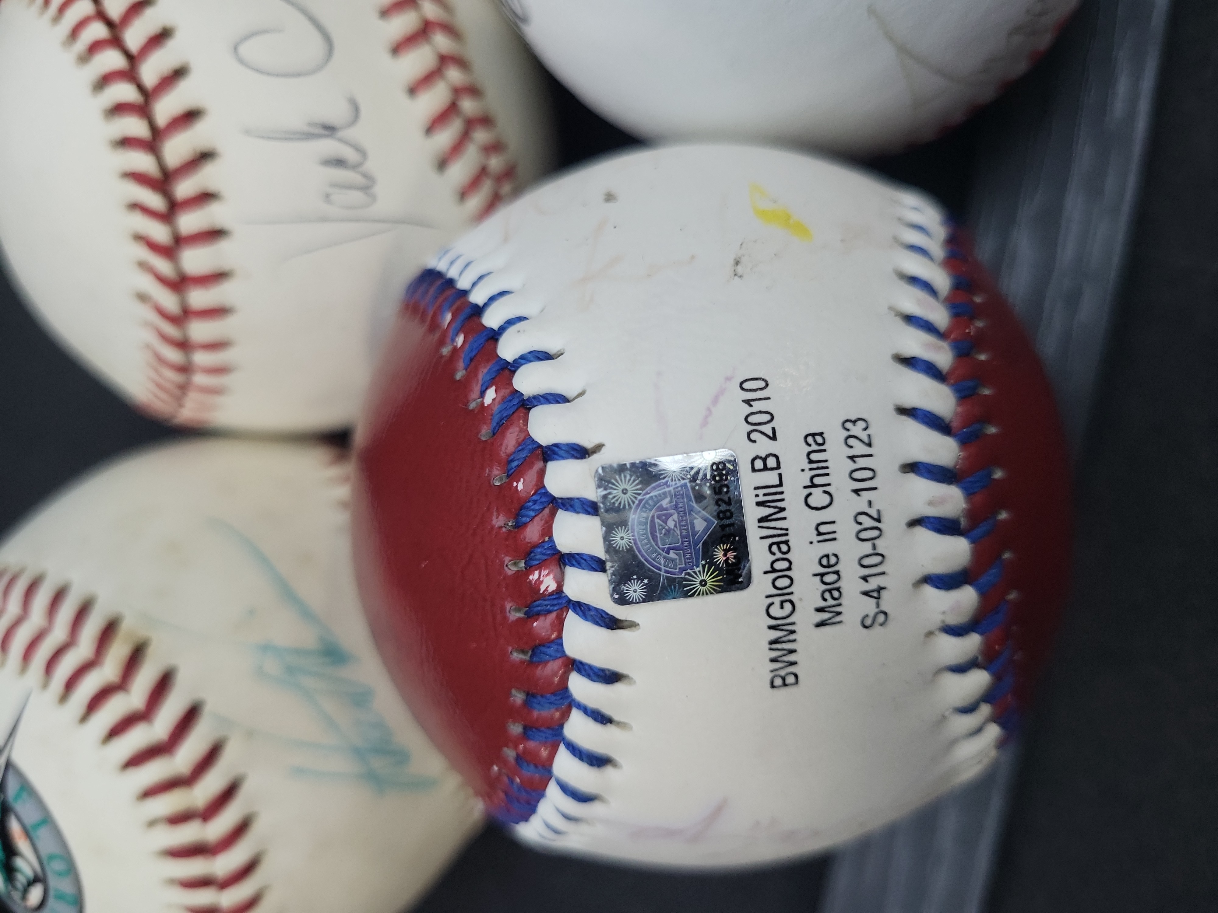 I03356 | A Collection of Seven Autographed and Novelty Baseballs Including Dale Earnhardt and Jack Clark
