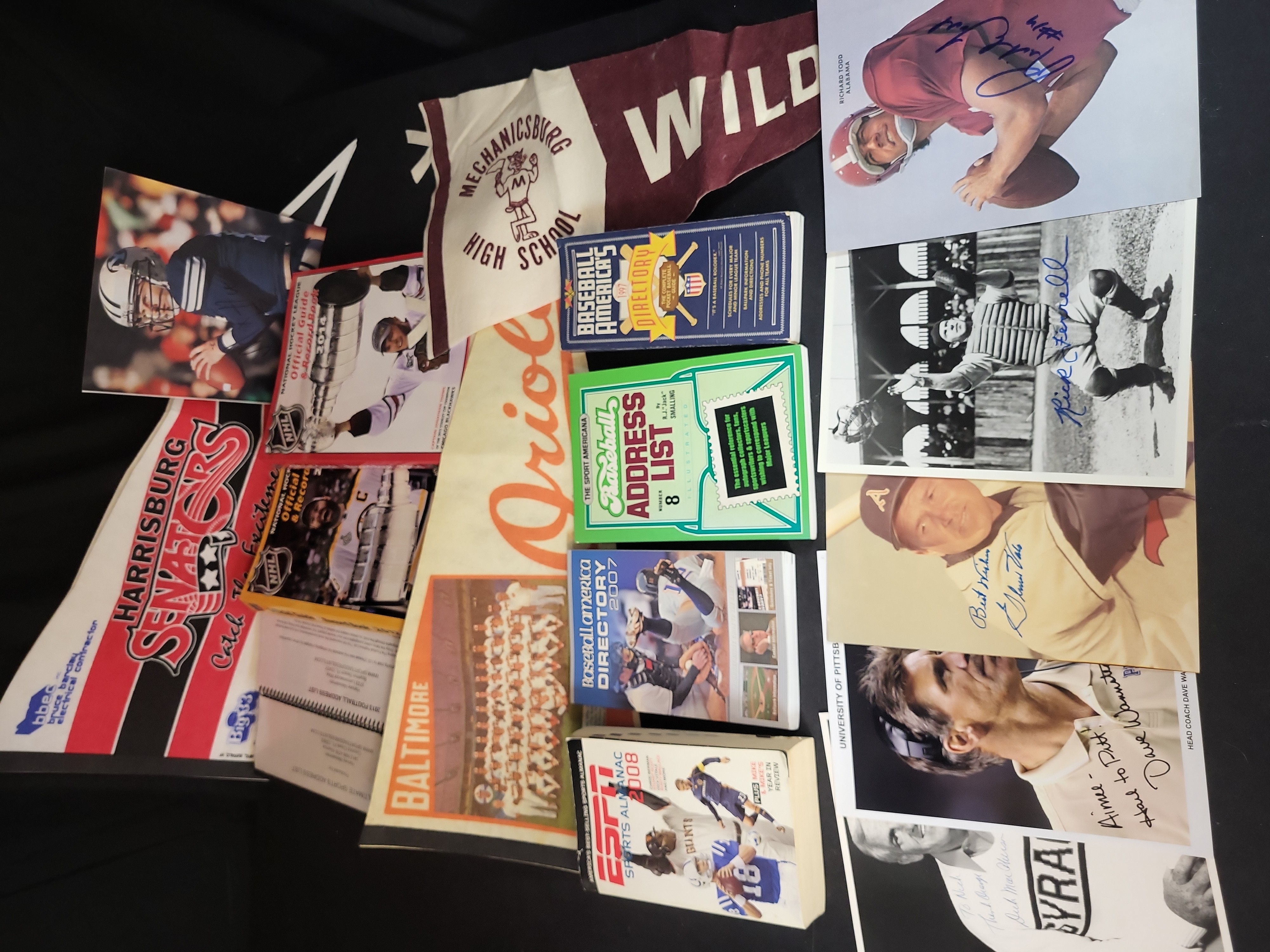 I03047 | A Collection of Sports Memorabilia Including Autographed Photographs, Vintage Pennants, and Reference Publications