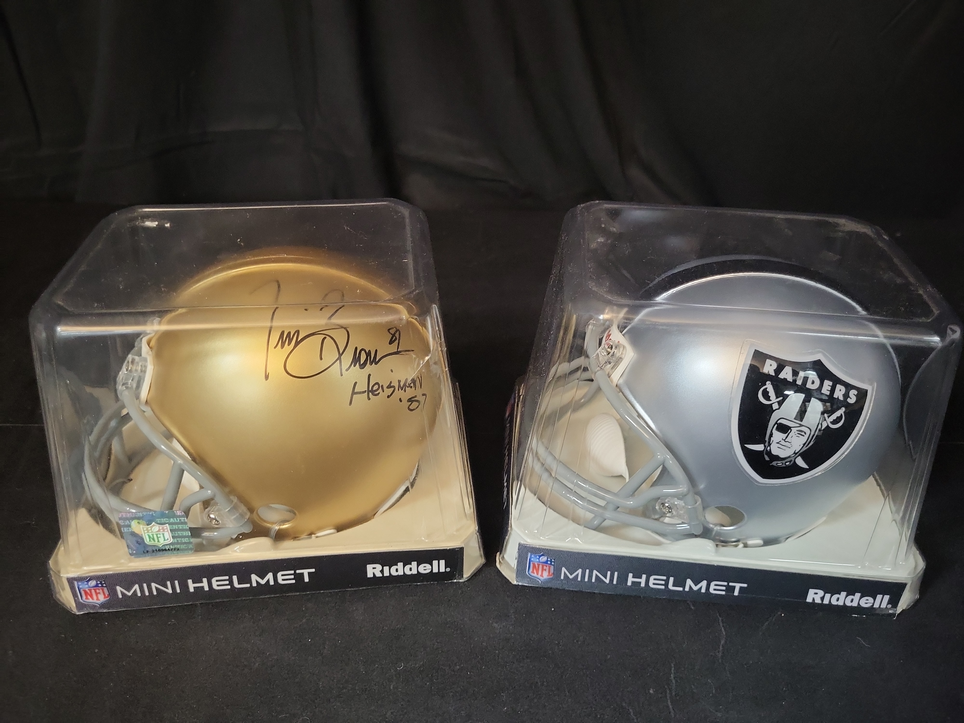 I03052 | A Pair of Riddell Mini Football Helmets Including a Signed Tim Brown Notre Dame Example and an Oakland Raiders Example