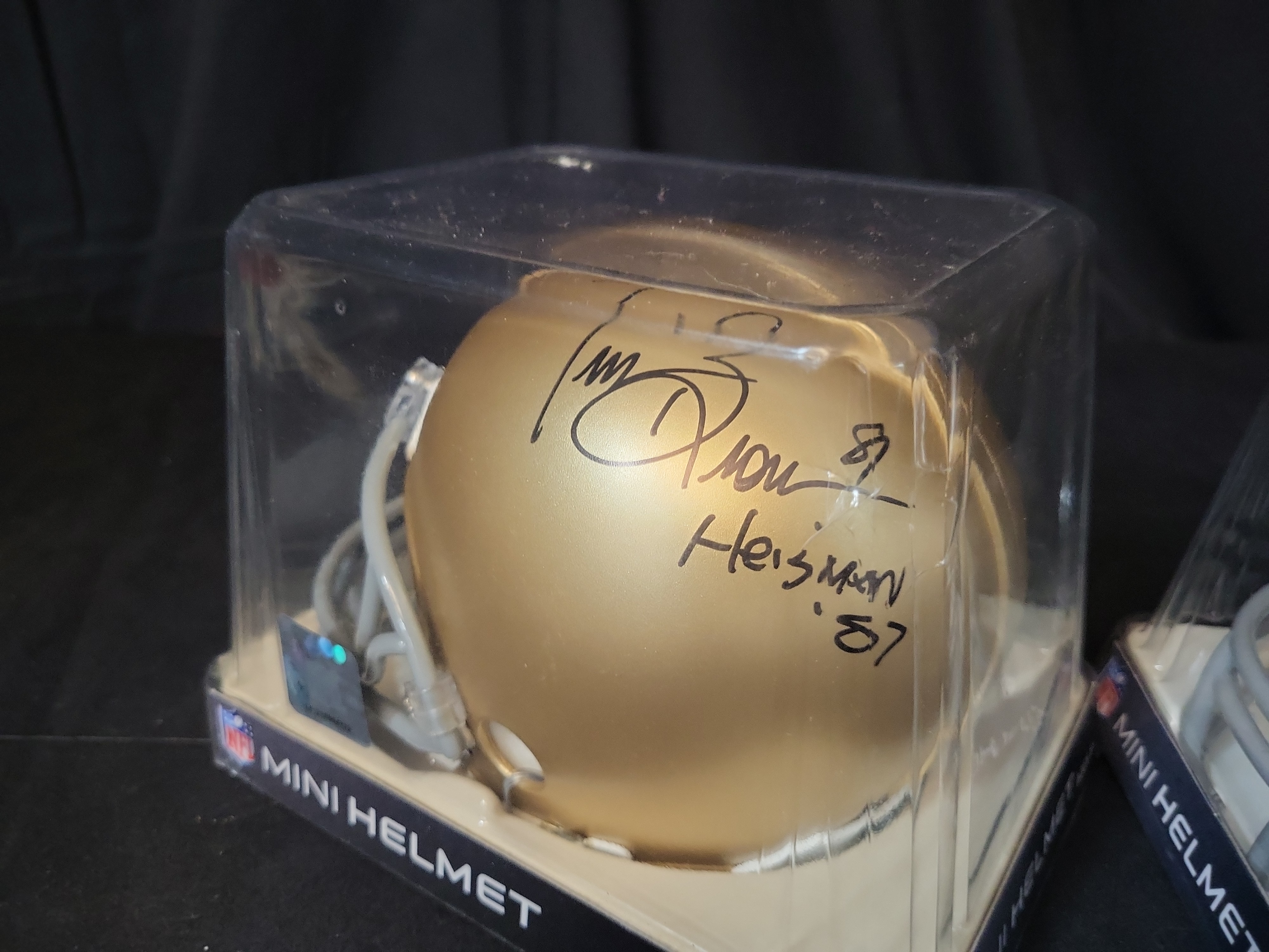 I03052 | A Pair of Riddell Mini Football Helmets Including a Signed Tim Brown Notre Dame Example and an Oakland Raiders Example