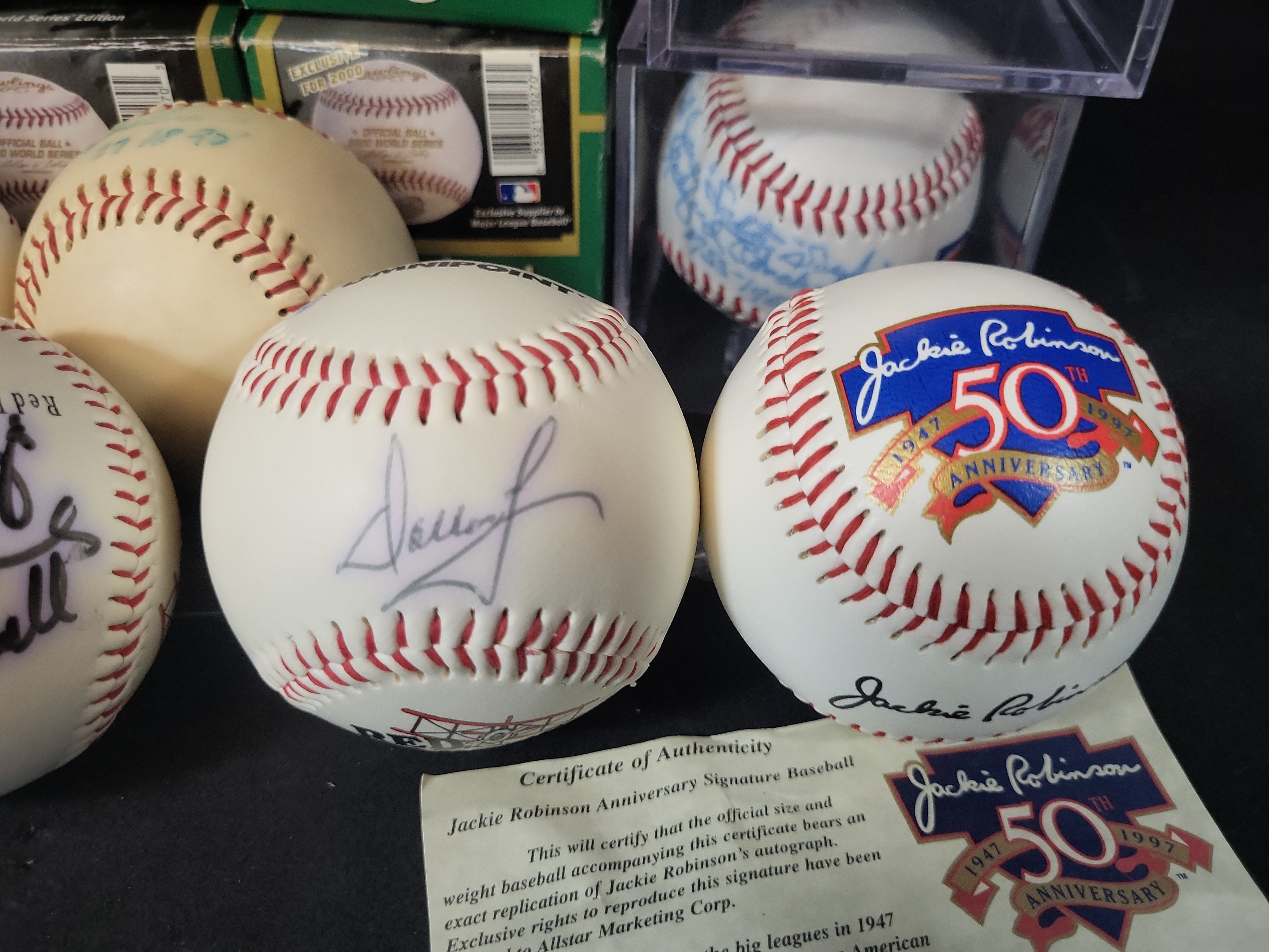 I03070 | Collection of Twelve Baseball Memorabilia Items Including Signed Balls and Official Packaging