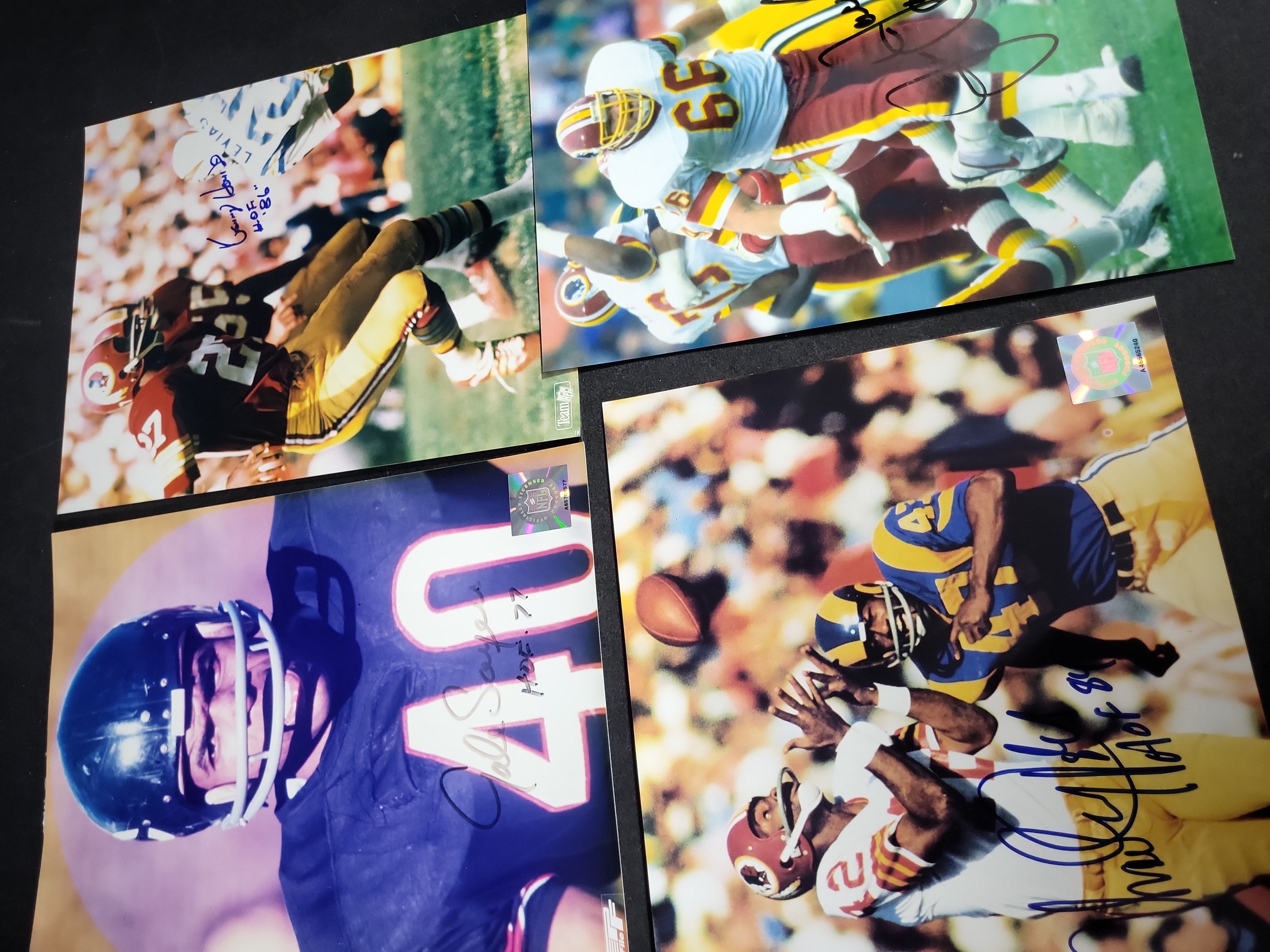 I03410 | A Lot of Four Autographed NFL Football Photographs Featuring Gale Sayers, Charley Taylor, Ken Houston, and Joe Jacoby