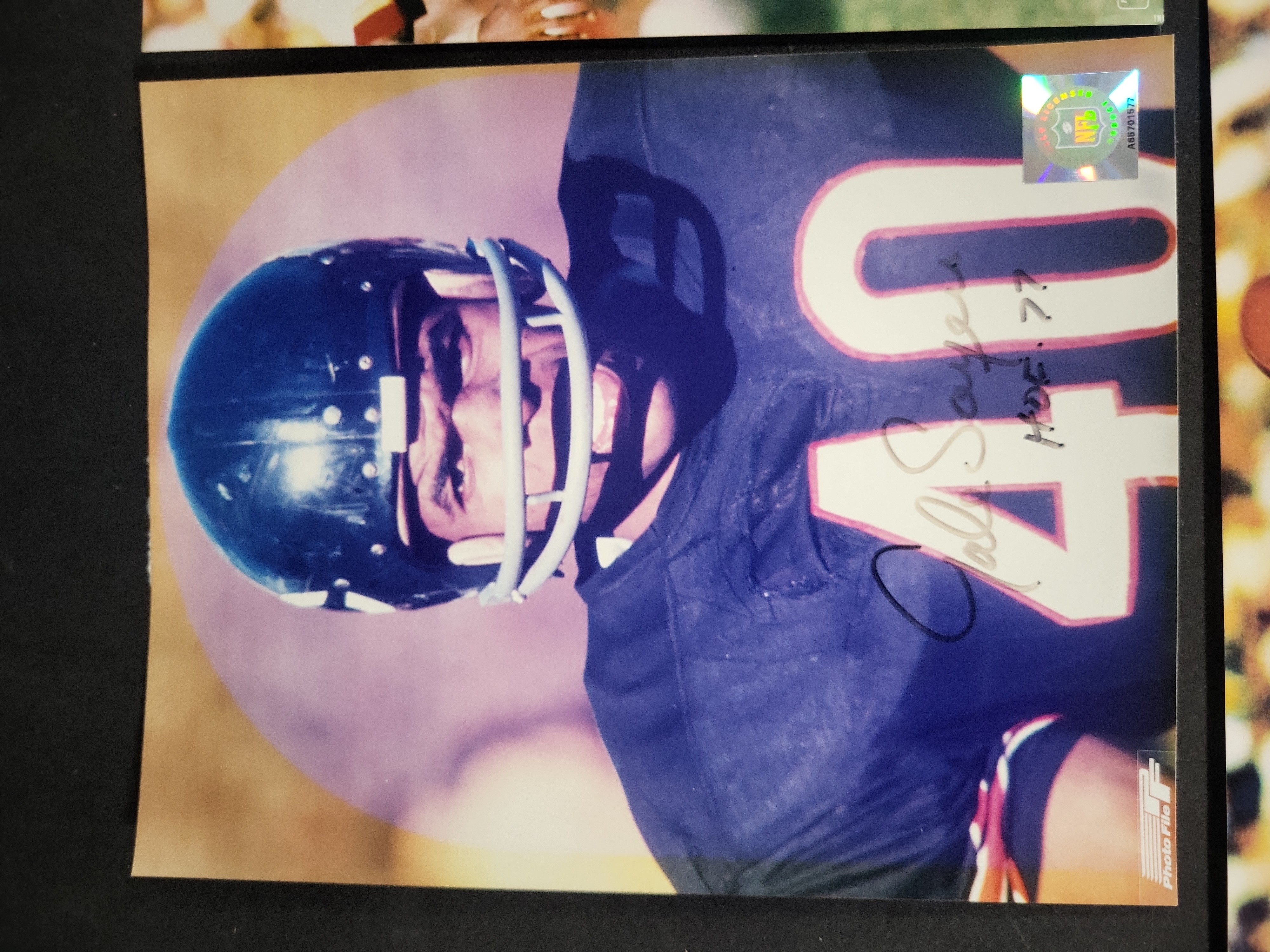 I03410 | A Lot of Four Autographed NFL Football Photographs Featuring Gale Sayers, Charley Taylor, Ken Houston, and Joe Jacoby