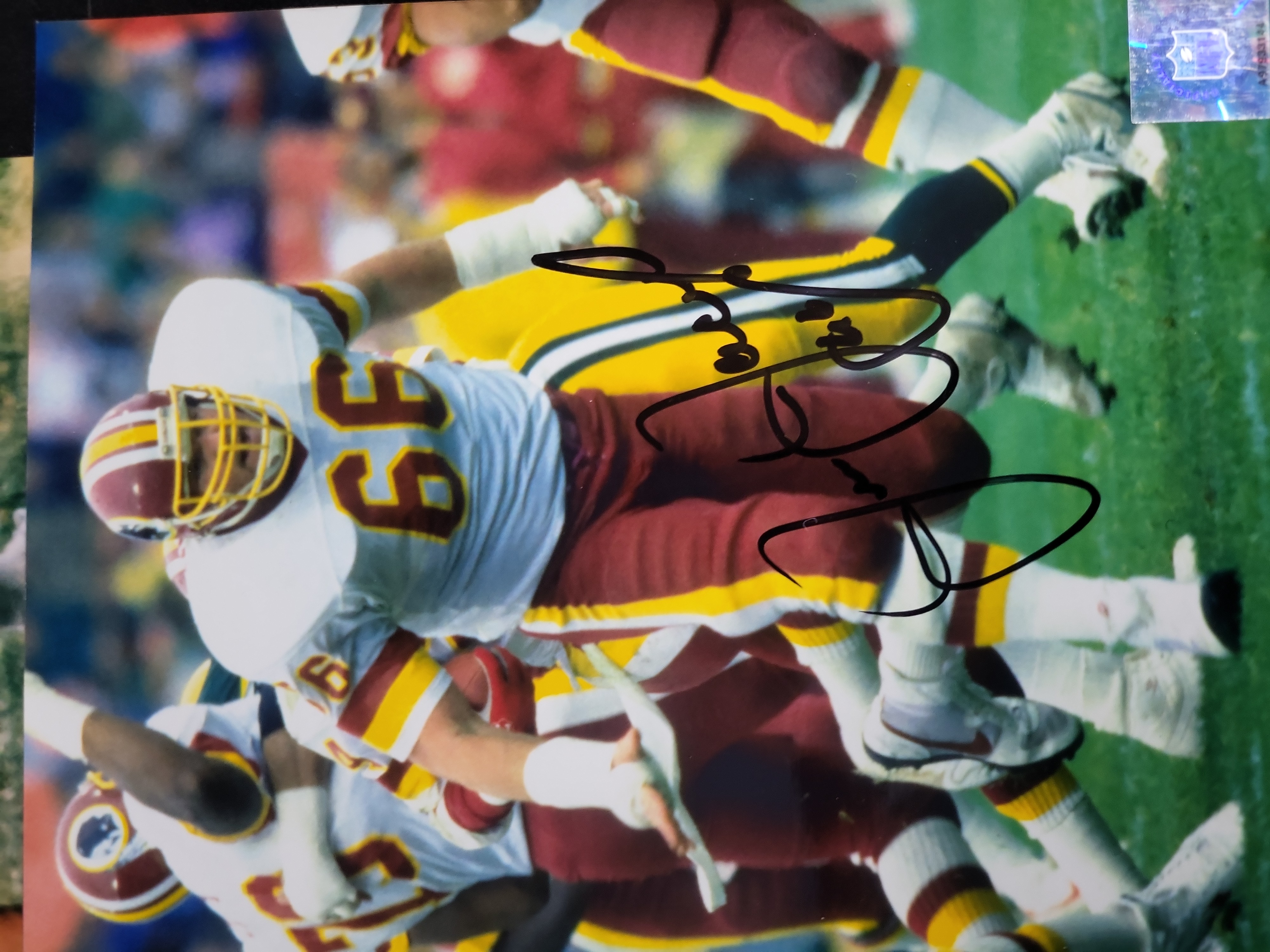 I03410 | A Lot of Four Autographed NFL Football Photographs Featuring Gale Sayers, Charley Taylor, Ken Houston, and Joe Jacoby