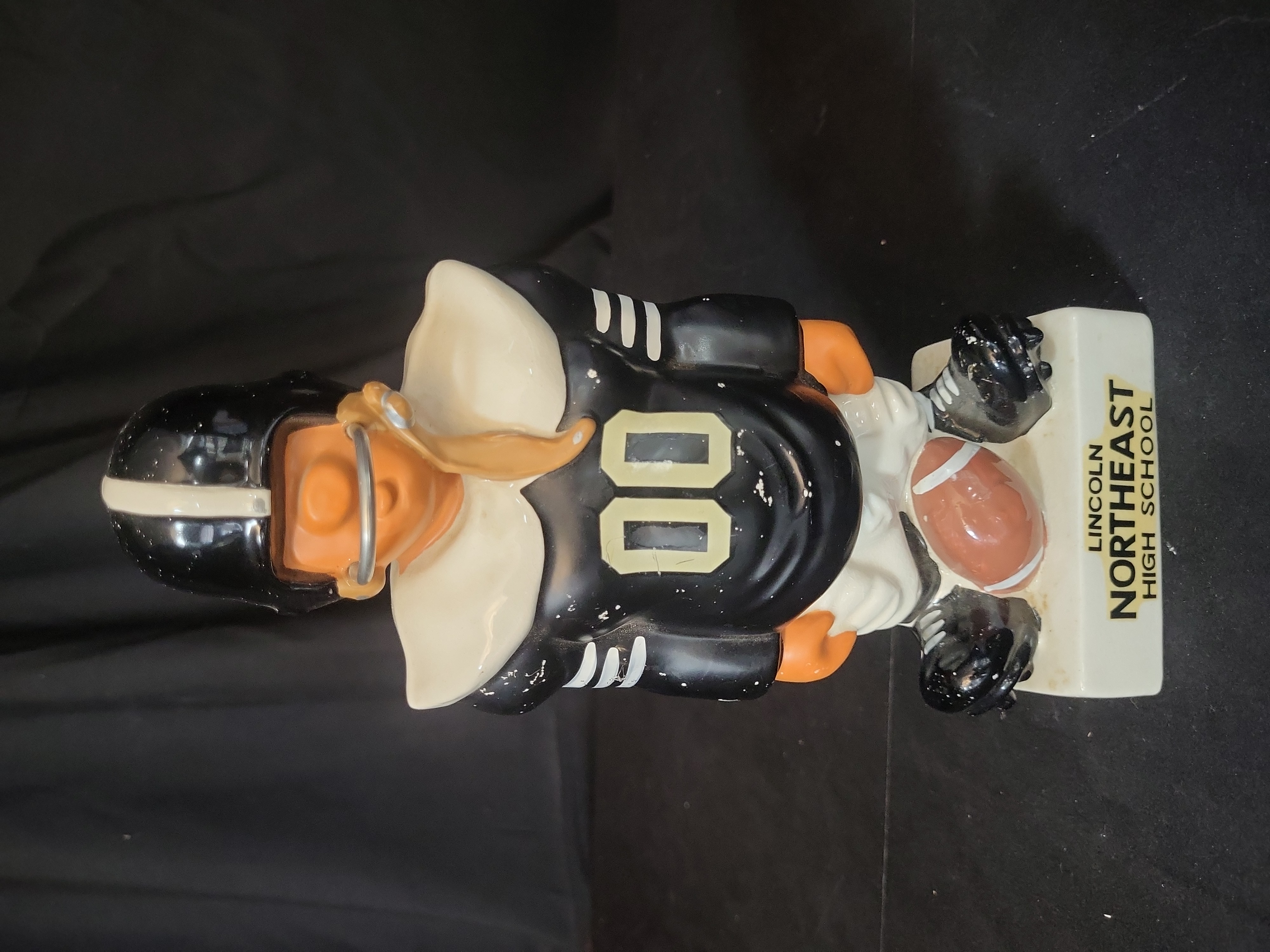 I03258 | Vintage Lincoln Northeast High School Ceramic Football Player Promotional Coin Bank Attributed to Fred Kail