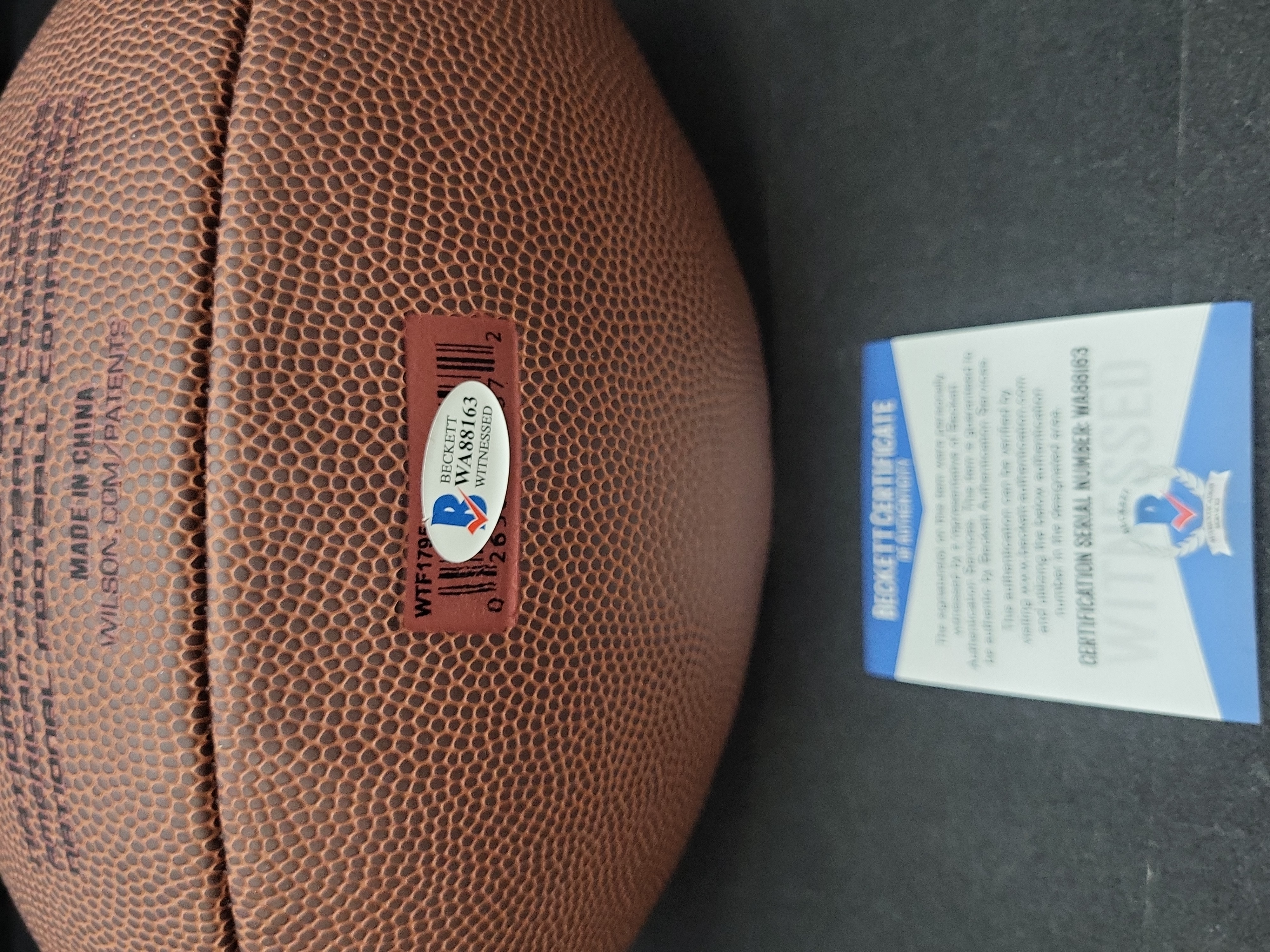I03571 | Brian Bosworth Signed Wilson Super Grip Official Size NFL Football Beckett Witnessed Authentication