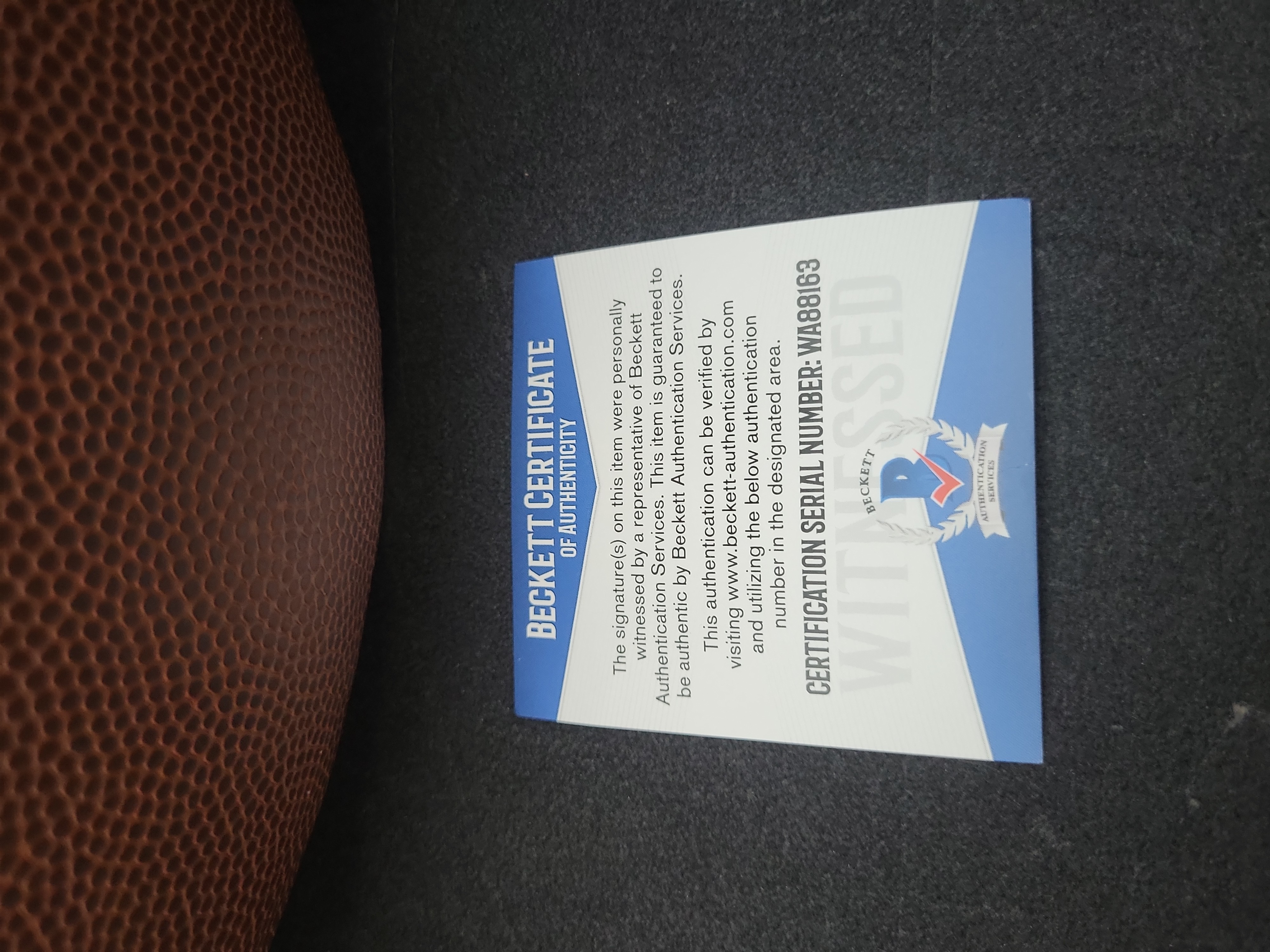 I03571 | Brian Bosworth Signed Wilson Super Grip Official Size NFL Football Beckett Witnessed Authentication
