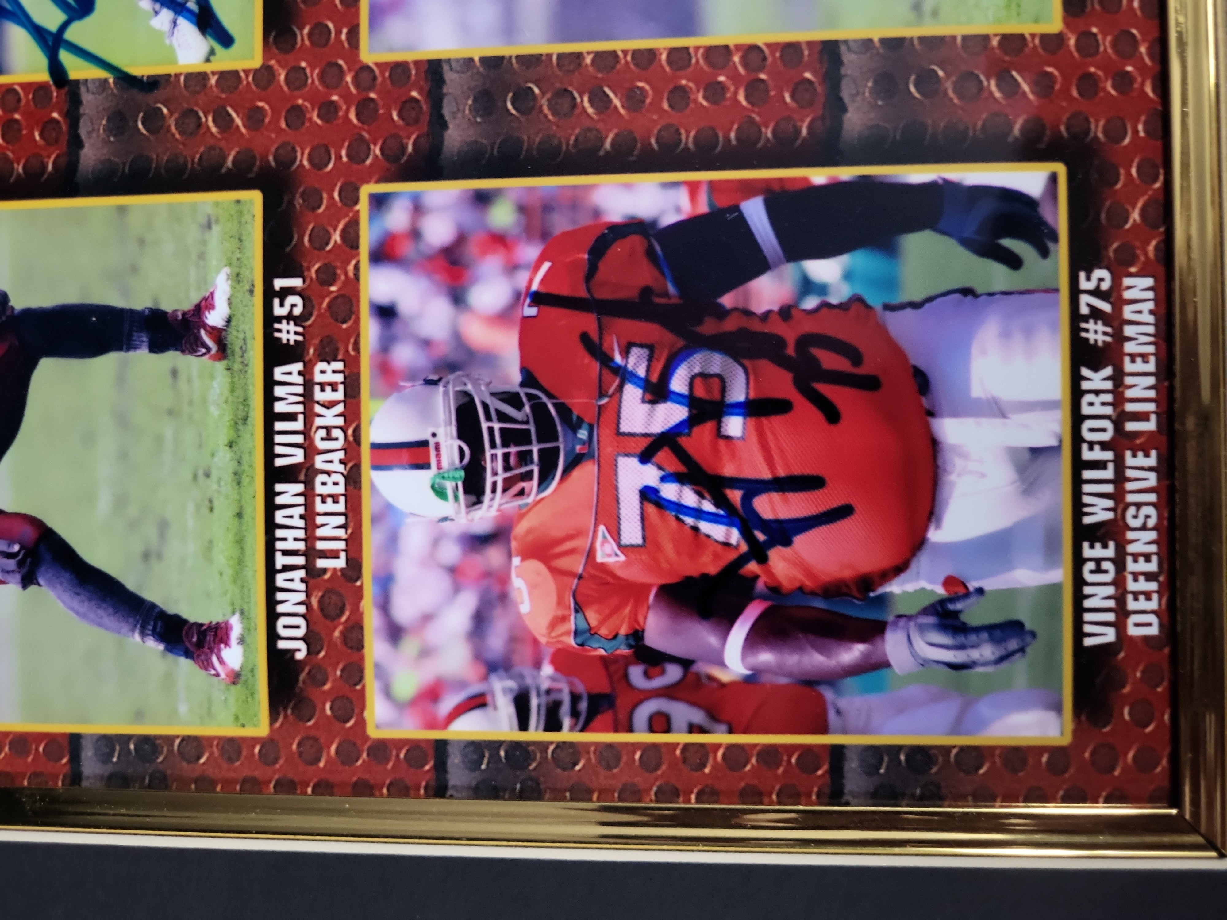 I03358 | Two Football Memorabilia Displays Including a Dan Marino Commemorative Plaque and a Multi-Signed University of Miami Hurricanes Fra