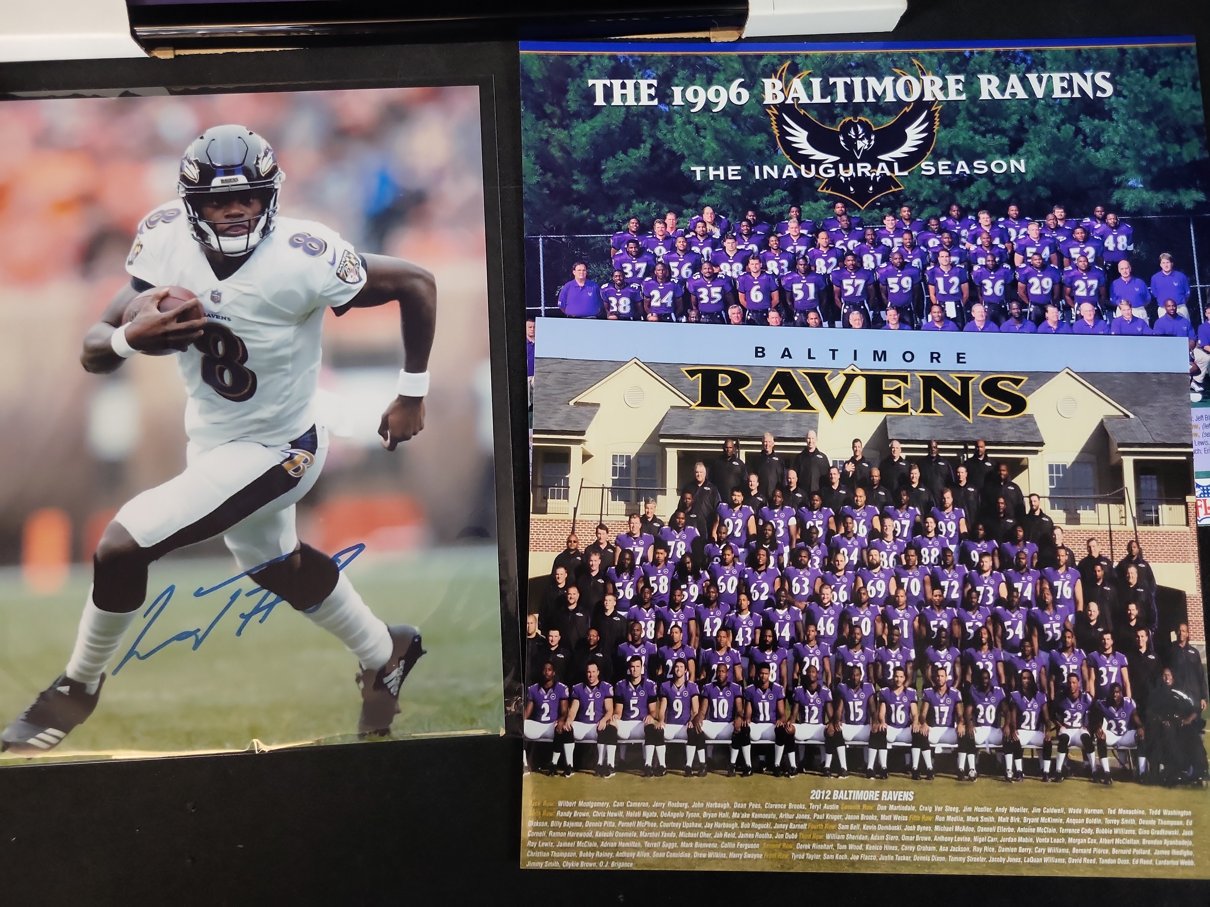 I03645 | A Collection of Baltimore Ravens Memorabilia Including Framed Joe Flacco Plaque and Autographed Lamar Jackson Photo