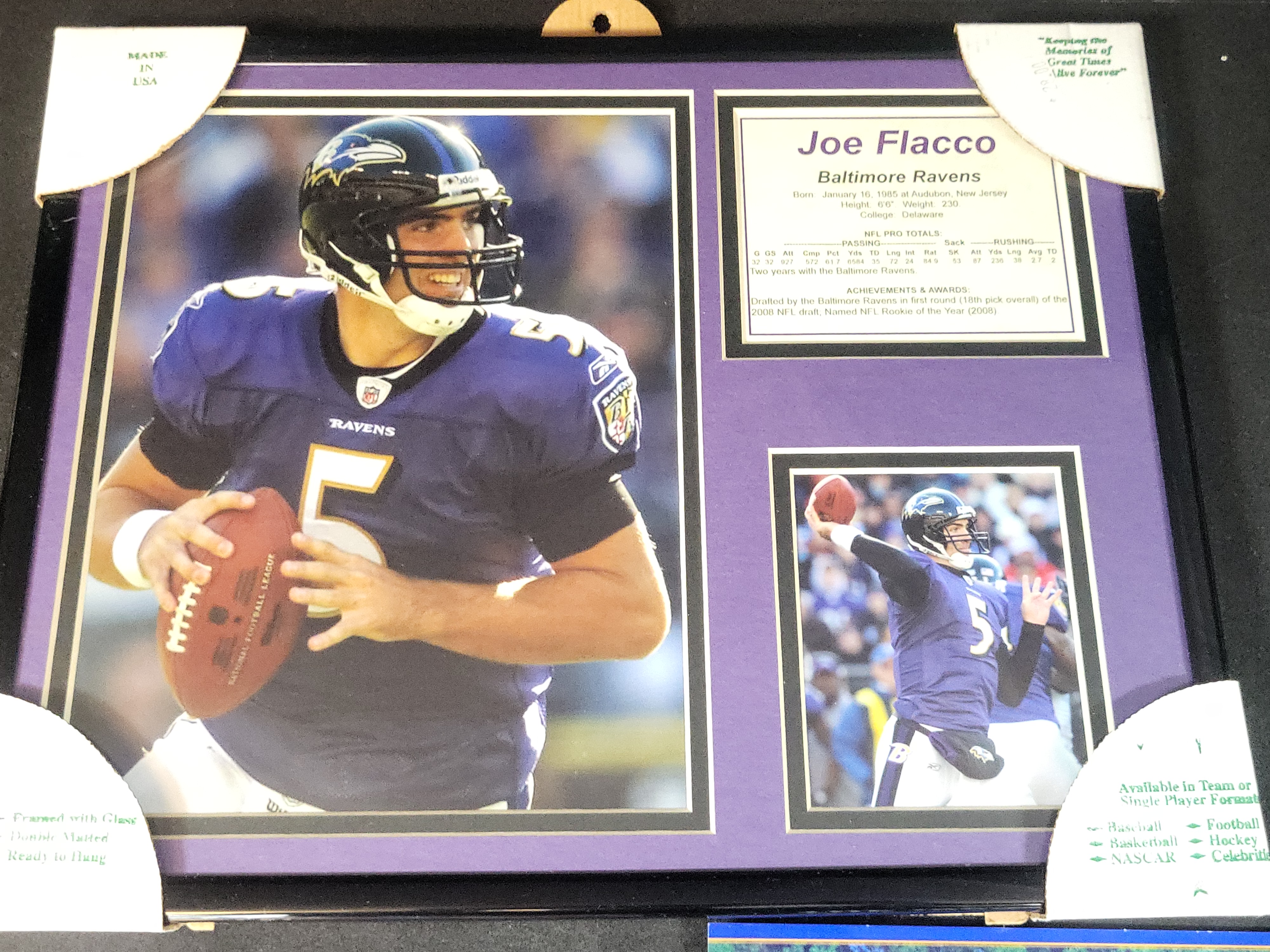 I03645 | A Collection of Baltimore Ravens Memorabilia Including Framed Joe Flacco Plaque and Autographed Lamar Jackson Photo