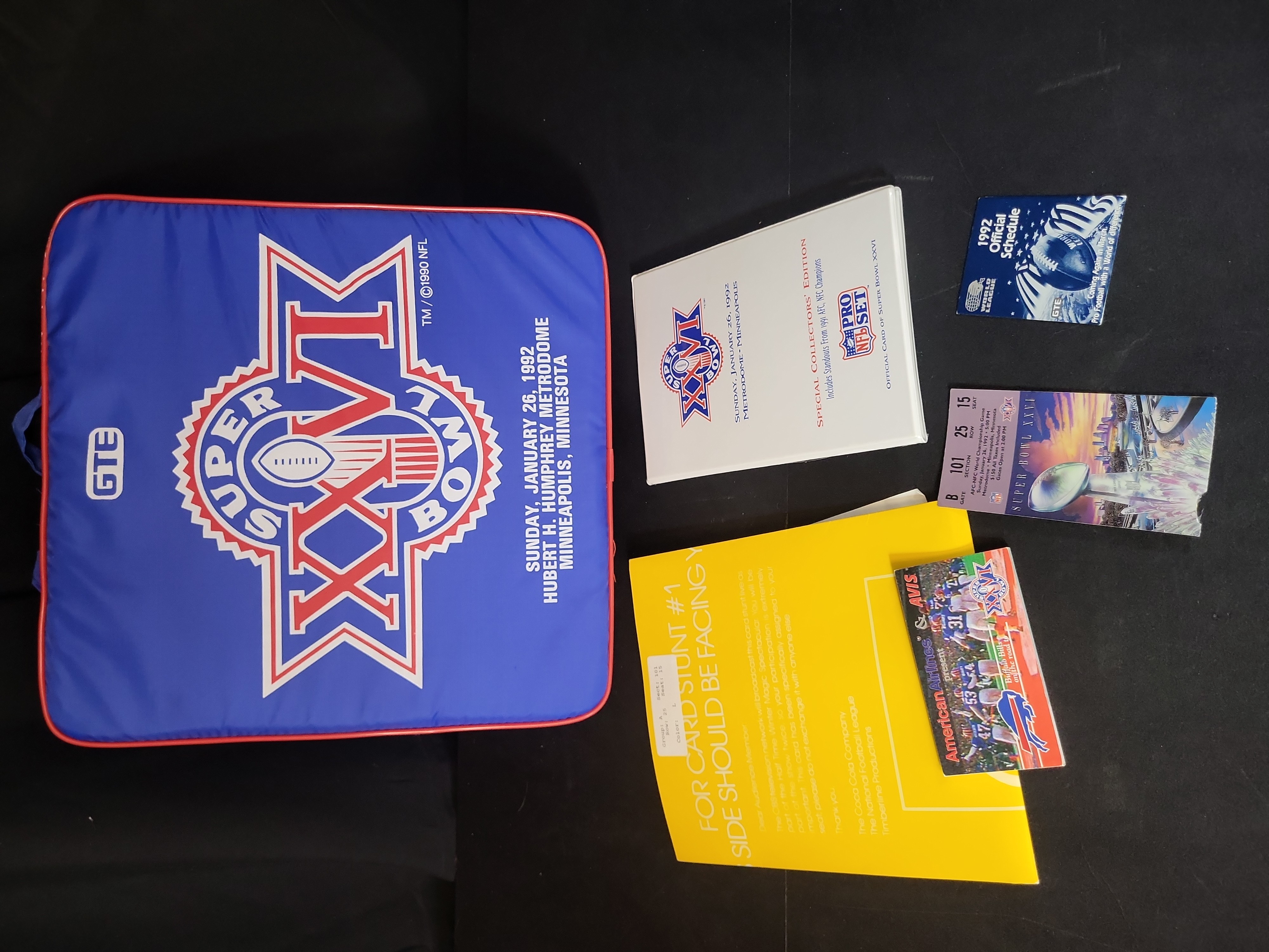 I03210 | A Collection of Super Bowl XXVI Memorabilia including Game Ticket, Seat Cushion, and Pro Set Card Binder