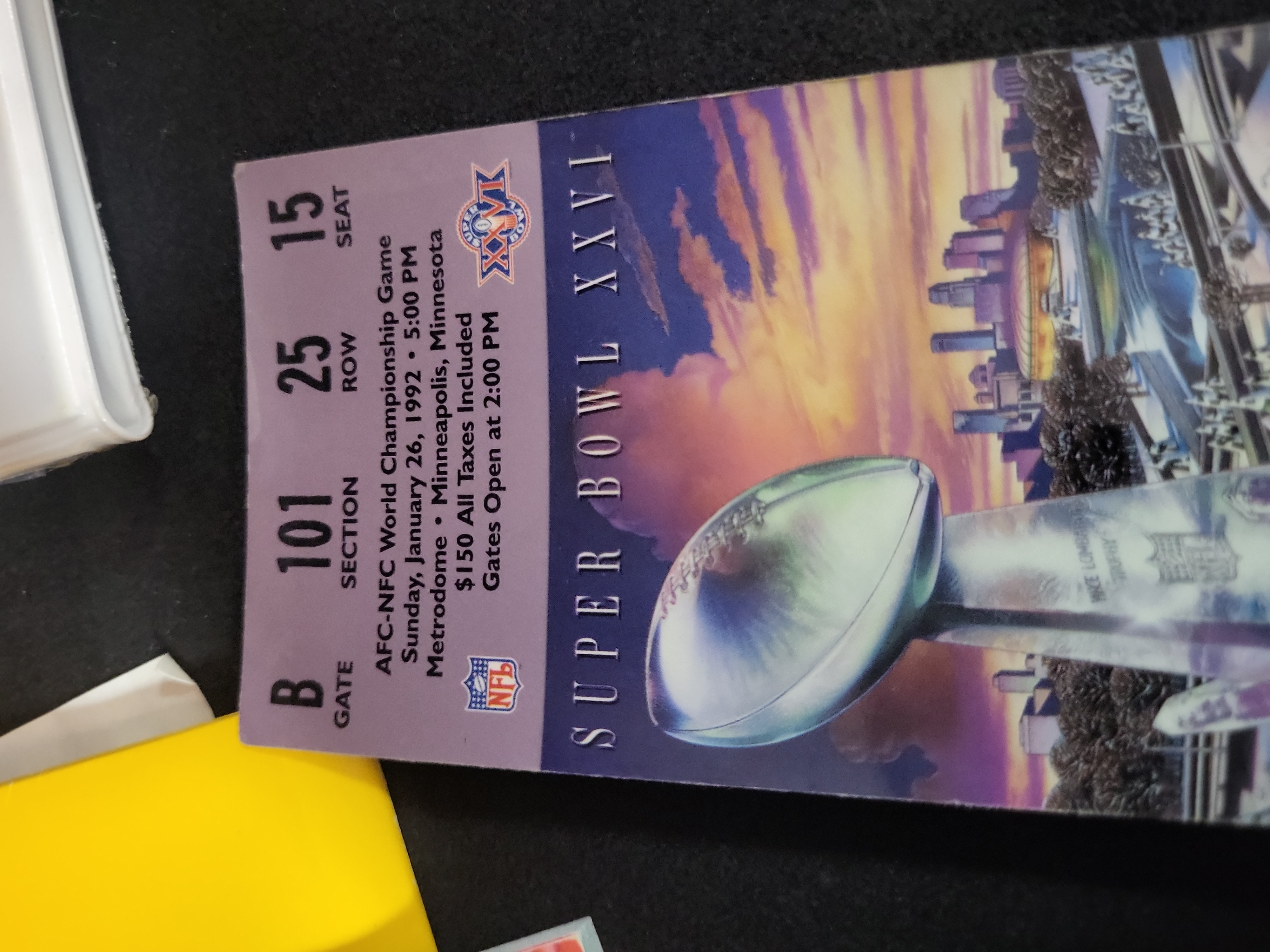 I03210 | A Collection of Super Bowl XXVI Memorabilia including Game Ticket, Seat Cushion, and Pro Set Card Binder