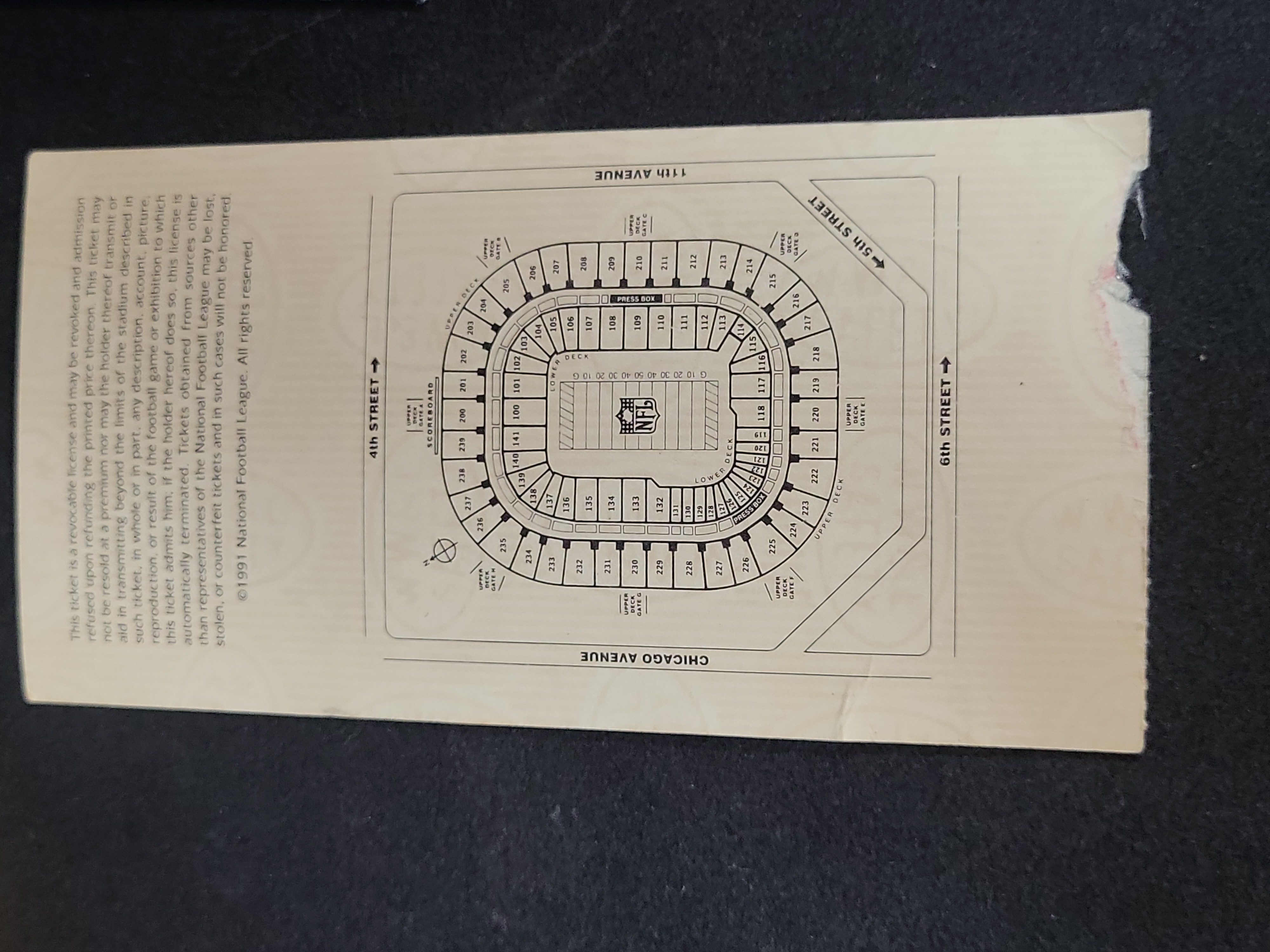 I03210 | A Collection of Super Bowl XXVI Memorabilia including Game Ticket, Seat Cushion, and Pro Set Card Binder