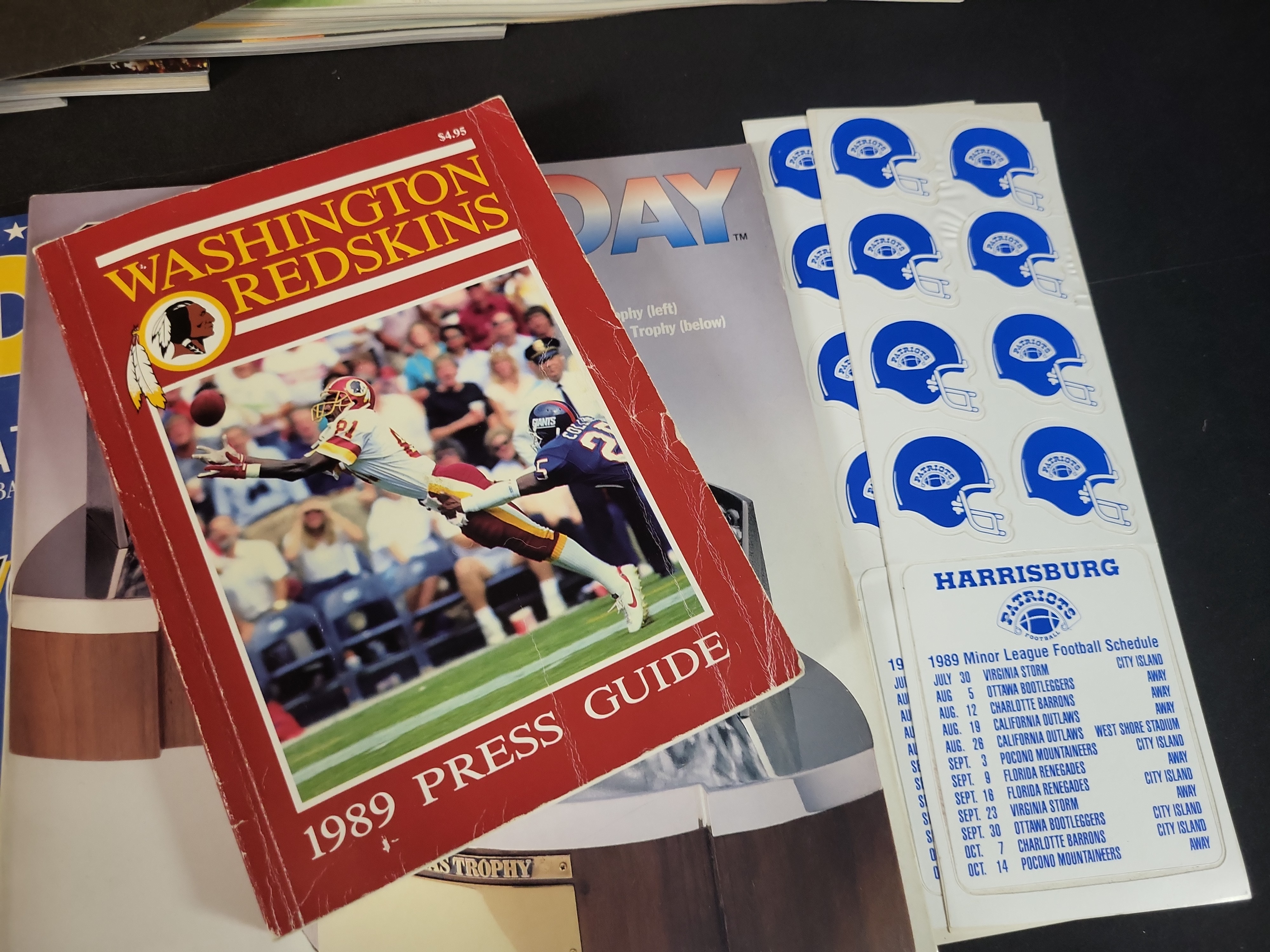I03043 | An Assortment of NFL and Minor League Football Memorabilia Featuring Signed Washington Redskins Pennant