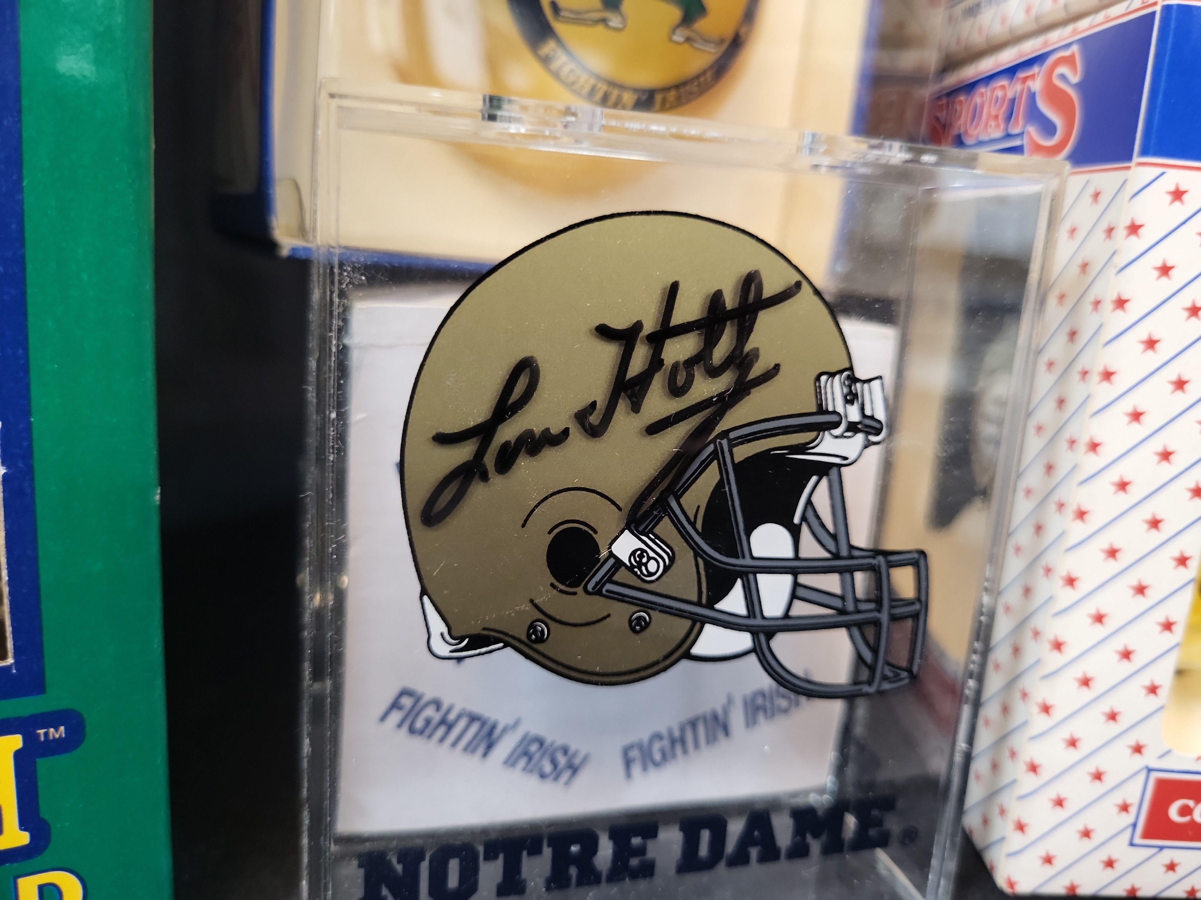 I03056 | A Collection of Four University of Notre Dame Fighting Irish Collectibles Including a Lou Holtz Signed Desk Accessory