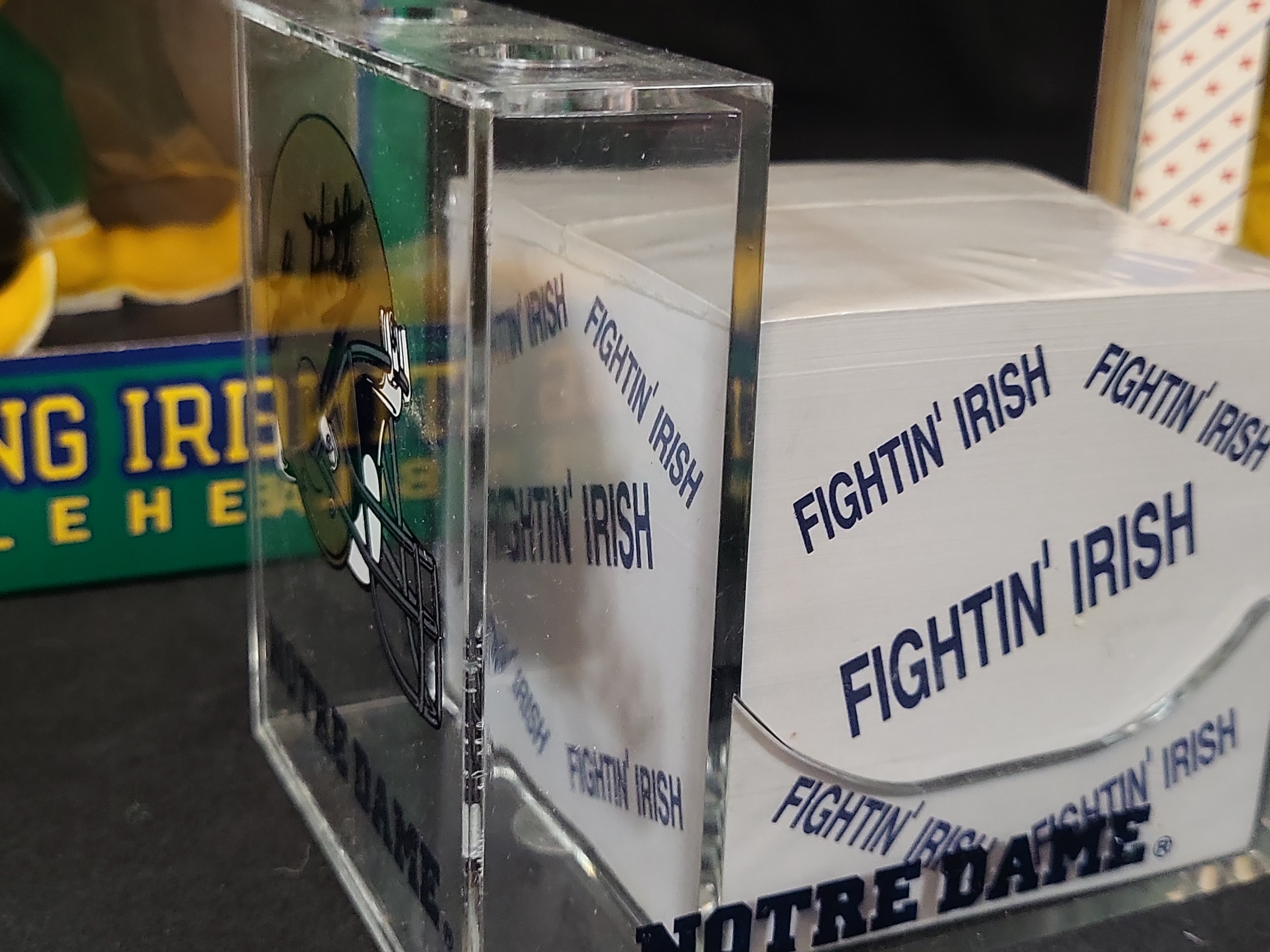 I03056 | A Collection of Four University of Notre Dame Fighting Irish Collectibles Including a Lou Holtz Signed Desk Accessory