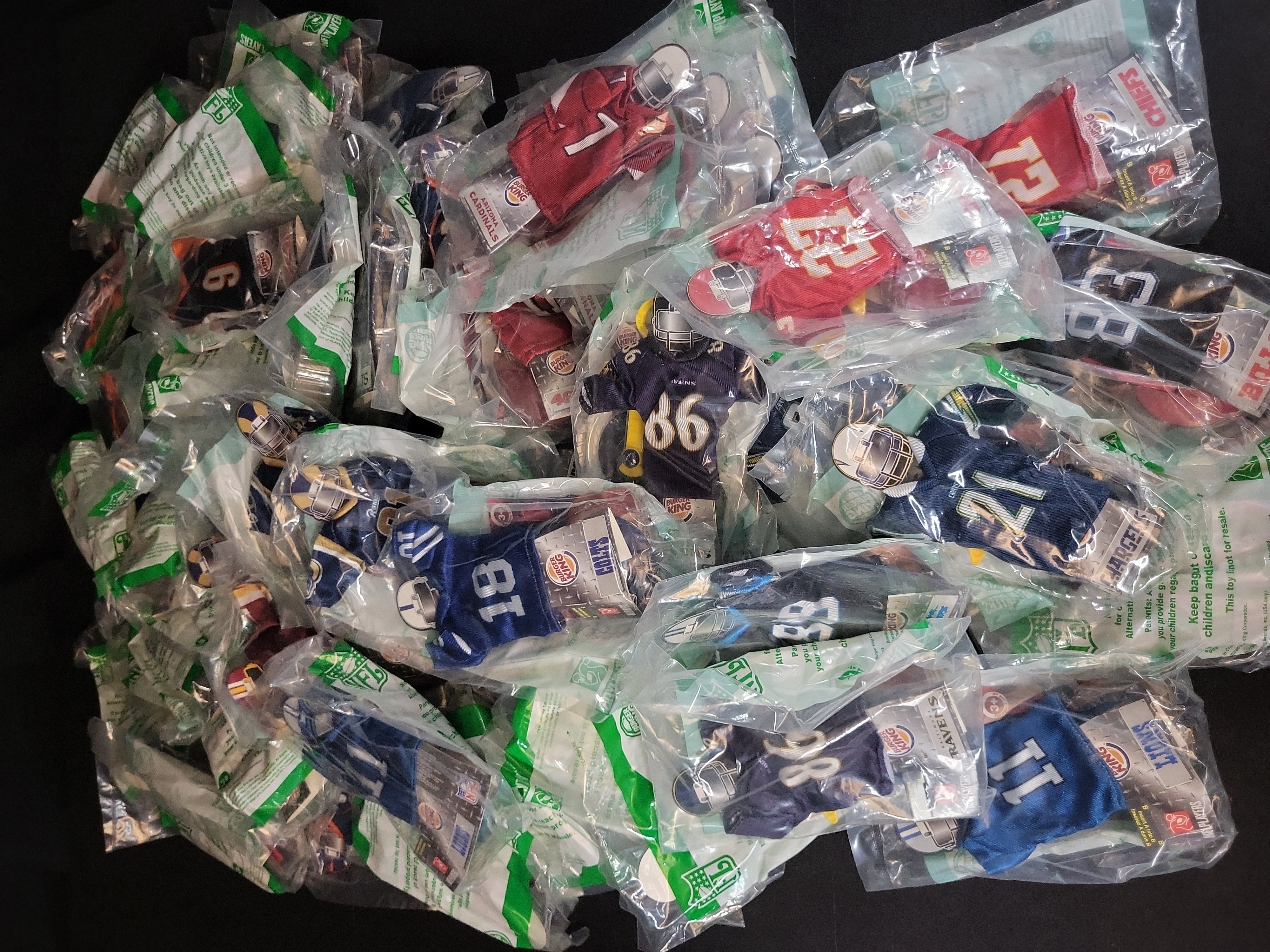 I03237 | A Collection of 2007 Burger King NFL Mini Jerseys in Original Packaging