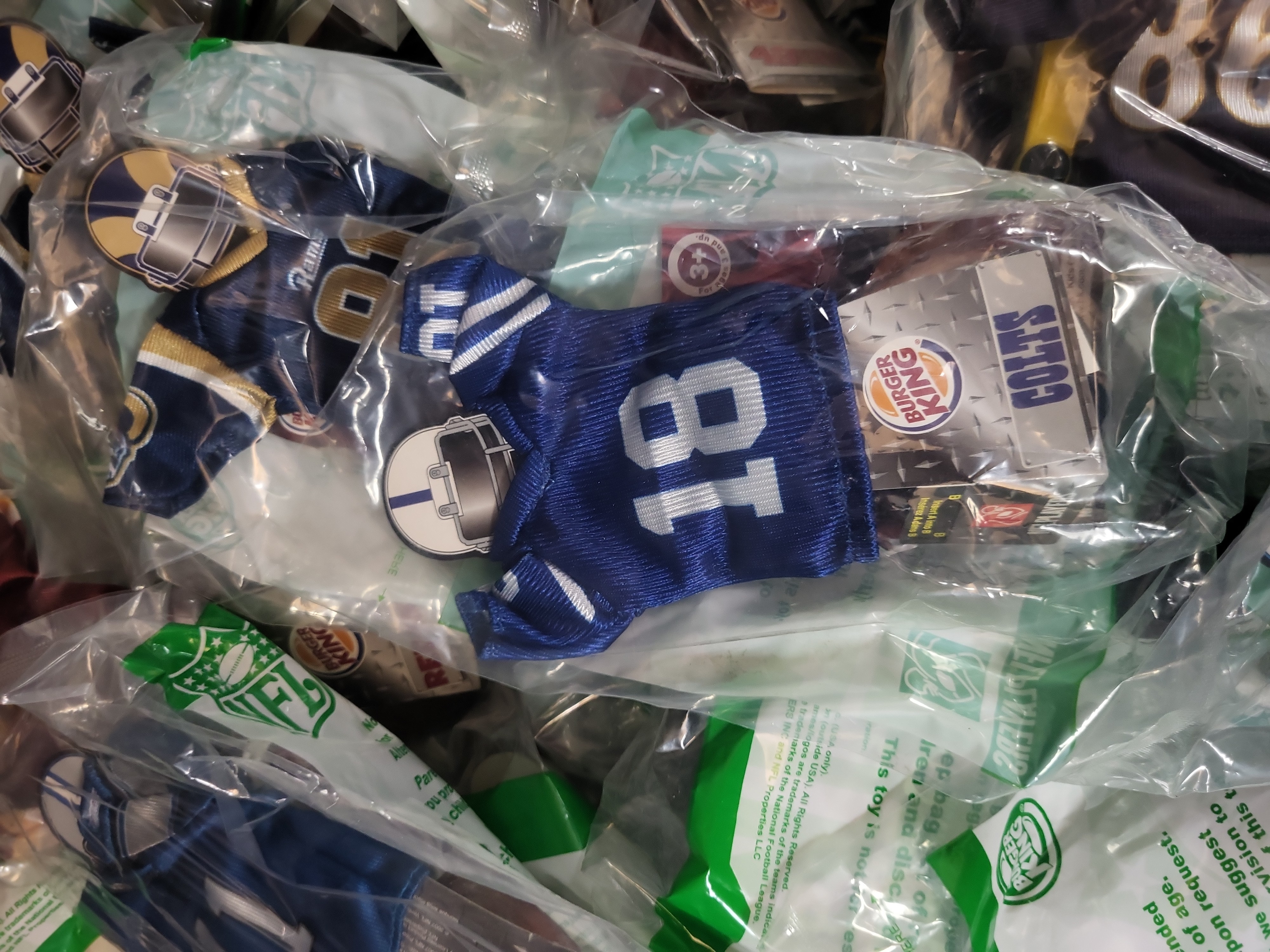 I03237 | A Collection of 2007 Burger King NFL Mini Jerseys in Original Packaging