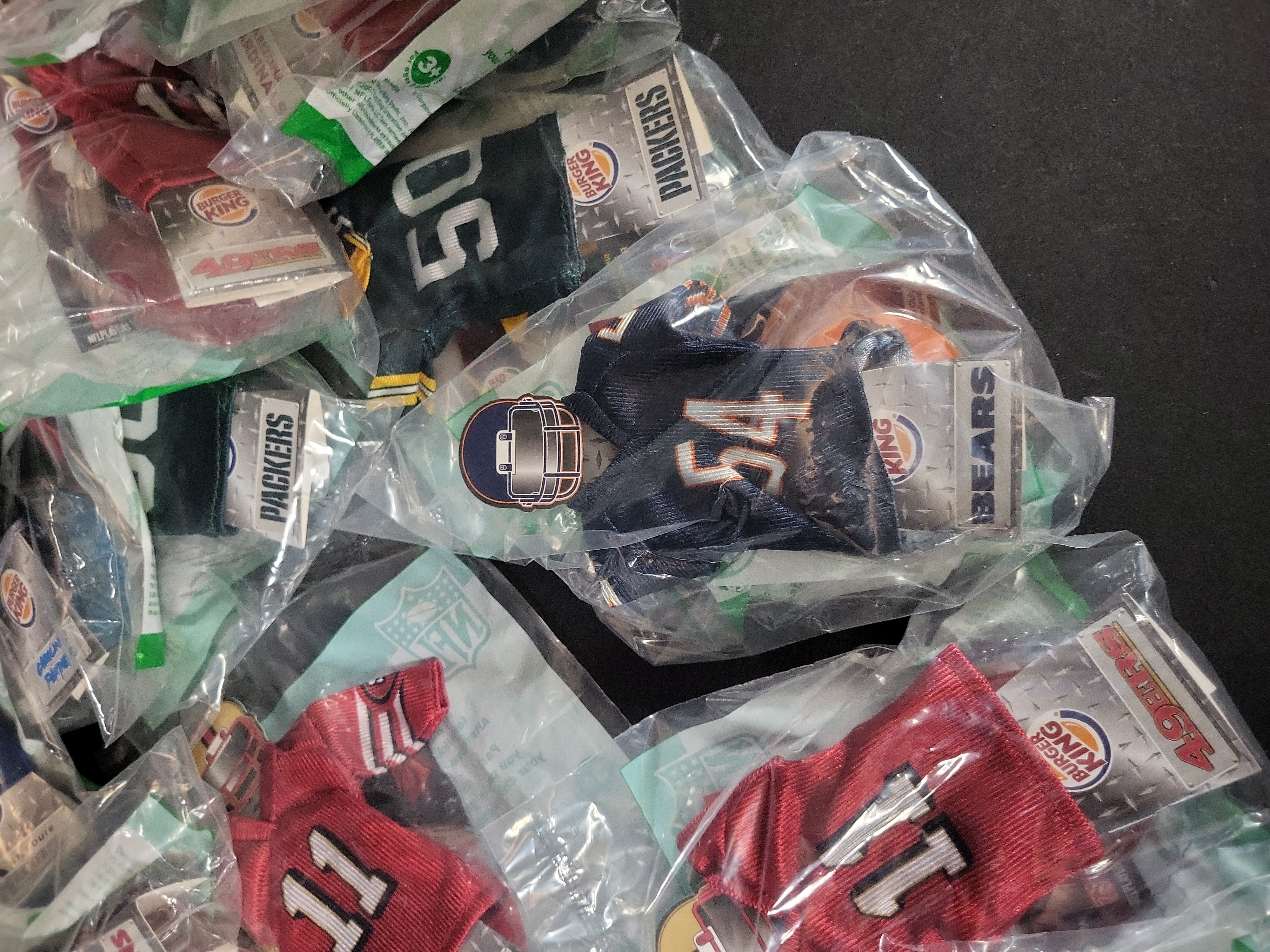 I03237 | A Collection of 2007 Burger King NFL Mini Jerseys in Original Packaging