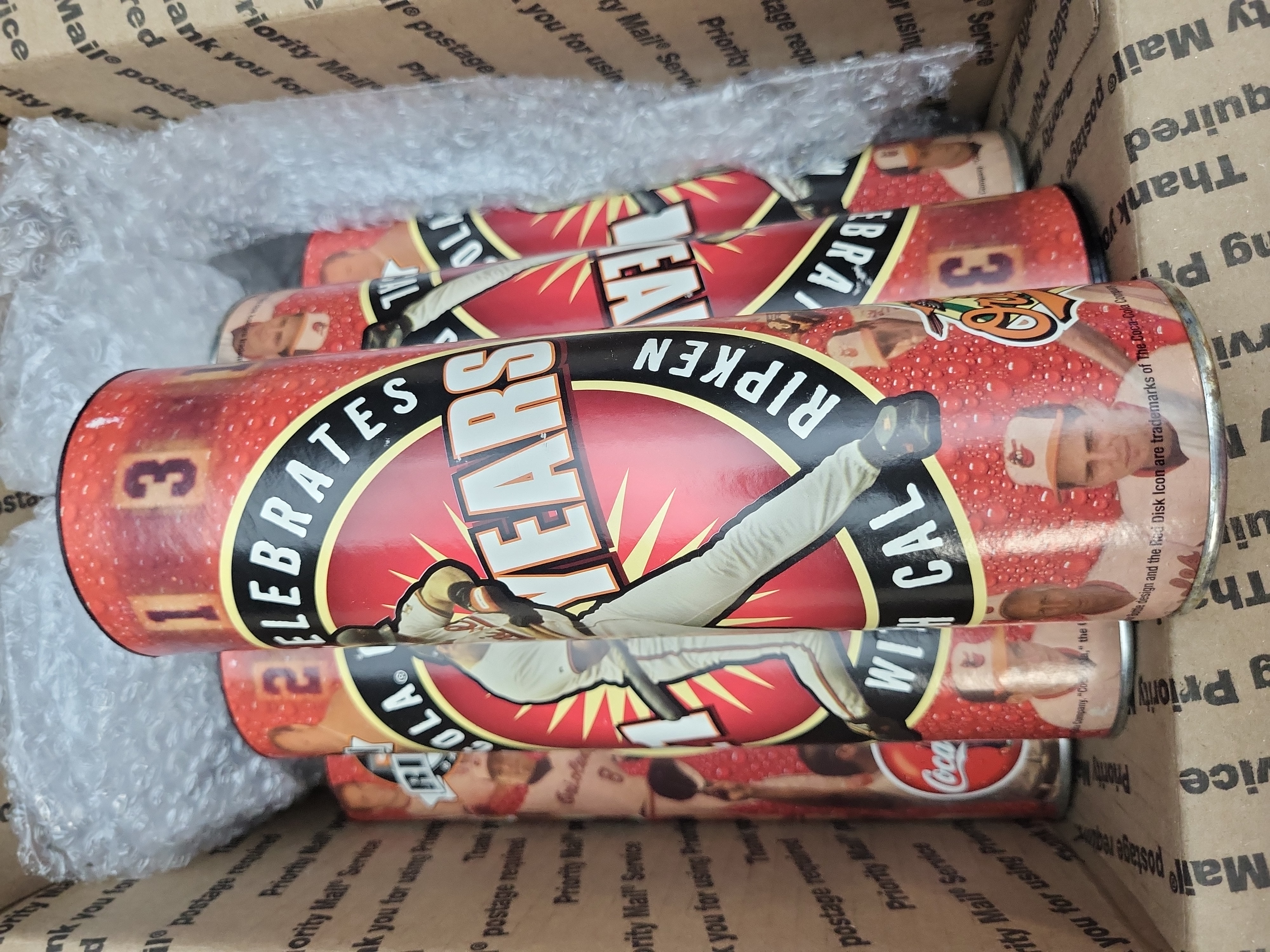 I03324 | A Collection of Cal Ripken Jr. Baltimore Orioles 21 Years Commemorative Coca-Cola Bottles and Tubes