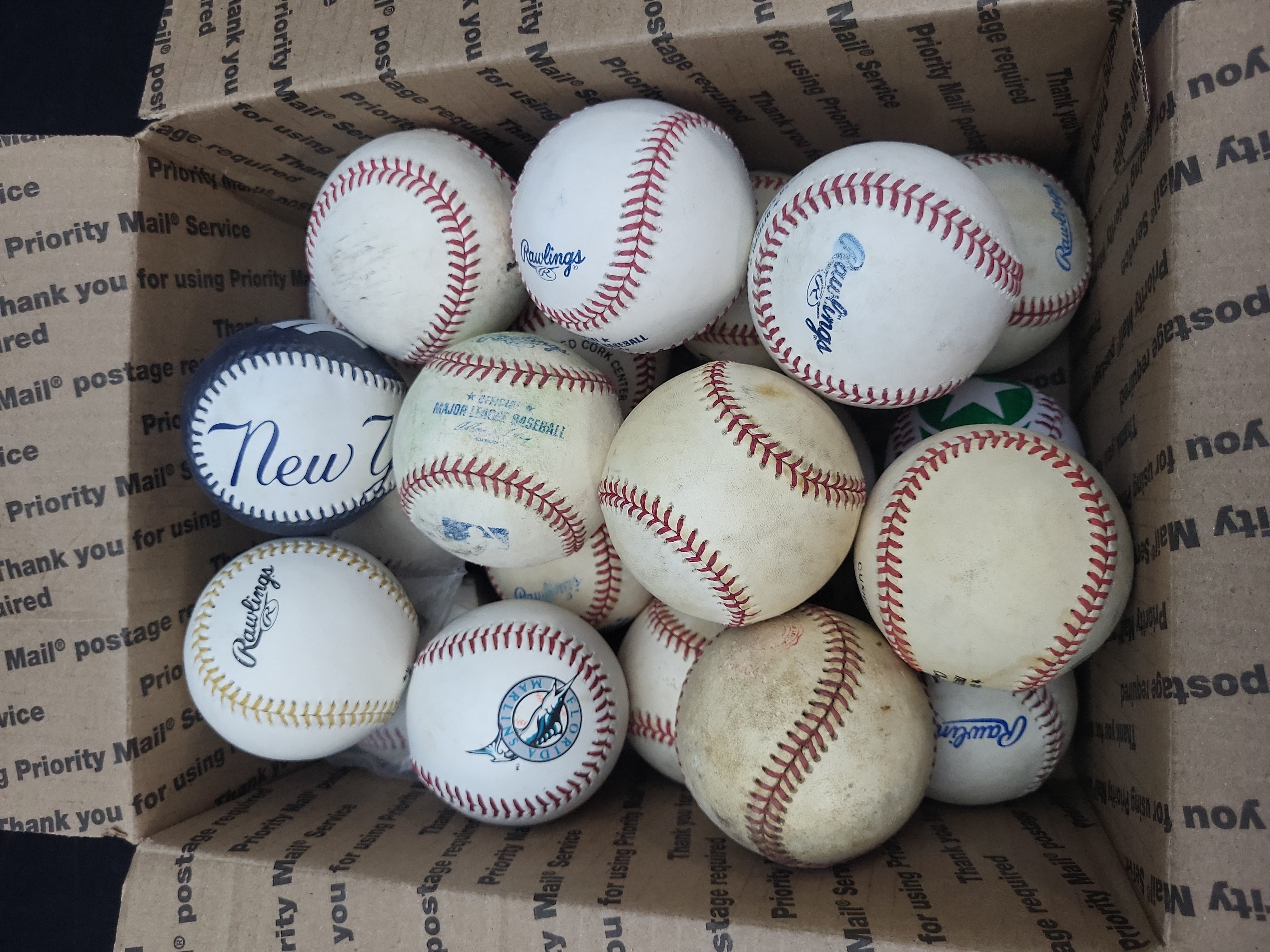 I03328 | A Collection of Approximately 17 Baseballs, Including Rawlings and Souvenir Examples
