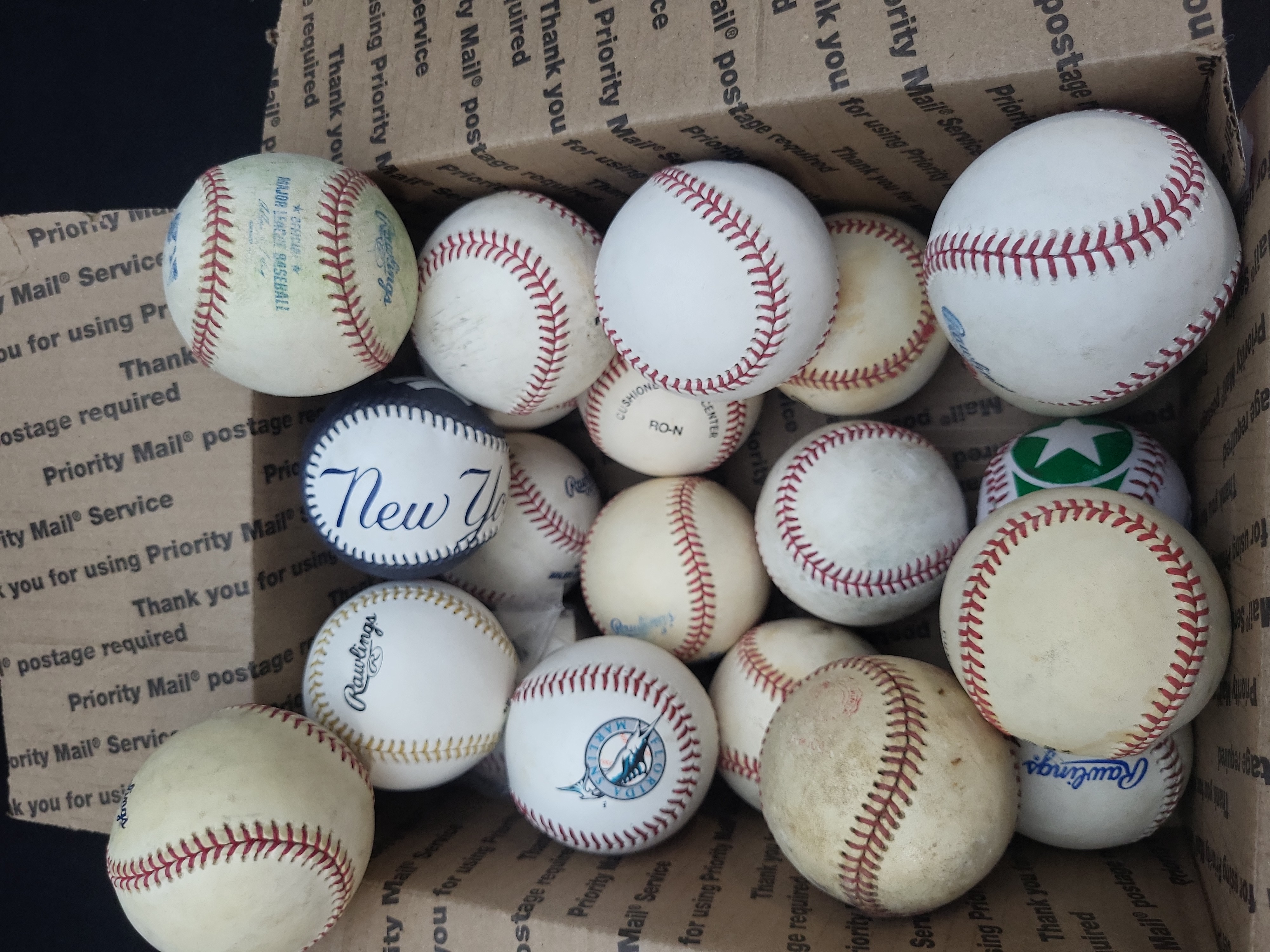I03328 | A Collection of Approximately 17 Baseballs, Including Rawlings and Souvenir Examples