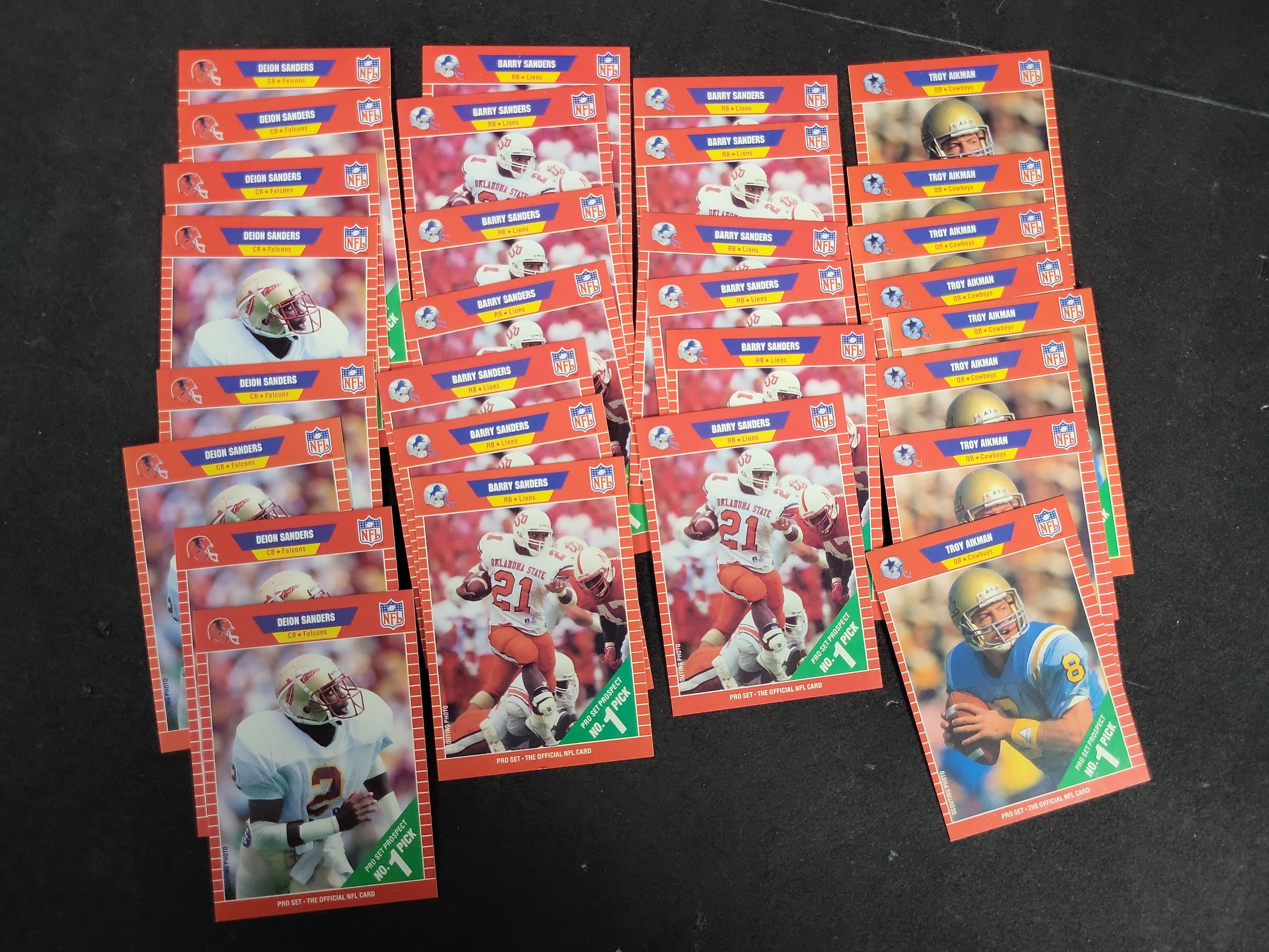 I03203 | Collection of 1989 Pro Set Football Rookie Cards featuring Barry Sanders, Troy Aikman, and Deion Sanders