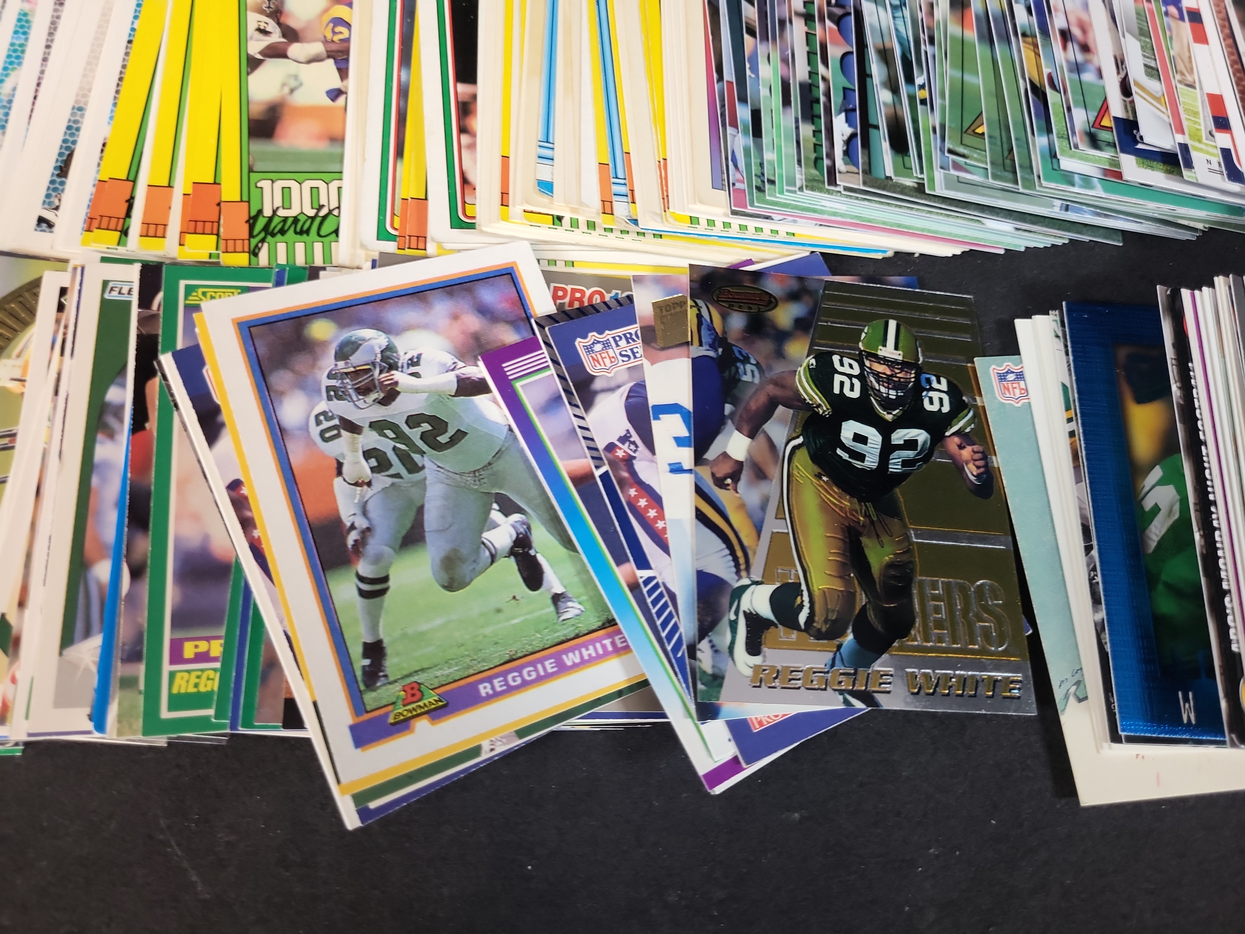 I03652 | An Assortment of Football Trading Cards Late 1980s to Mid 2000s Featuring Joe Montana Bo Jackson and Reggie White