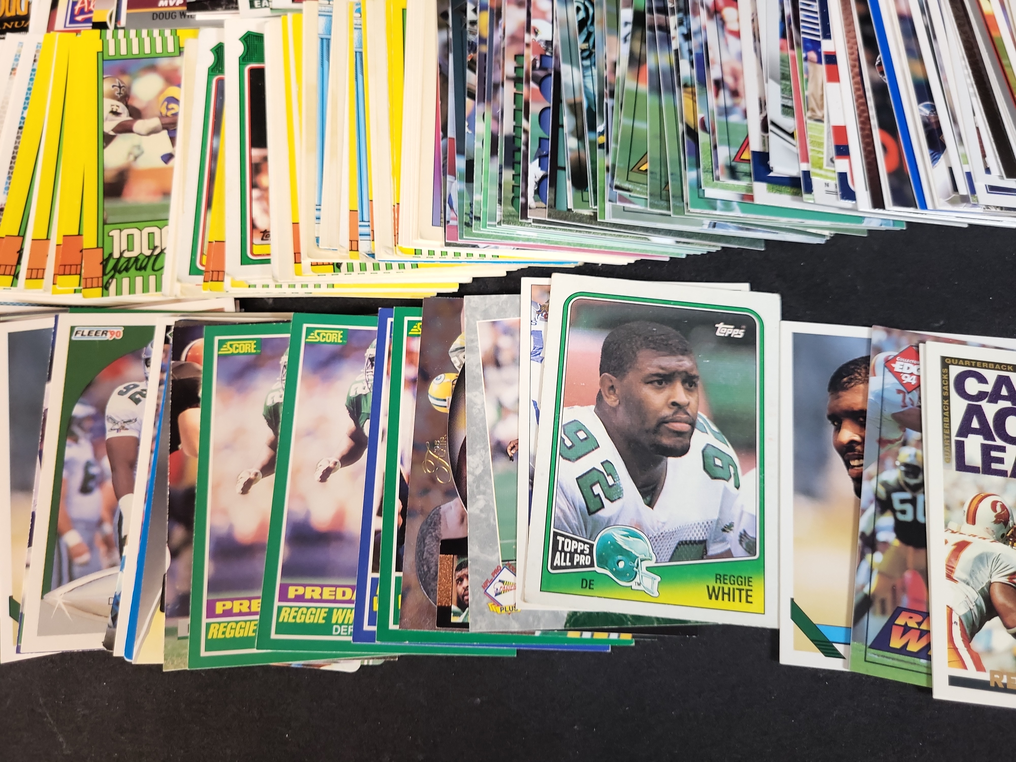 I03652 | An Assortment of Football Trading Cards Late 1980s to Mid 2000s Featuring Joe Montana Bo Jackson and Reggie White