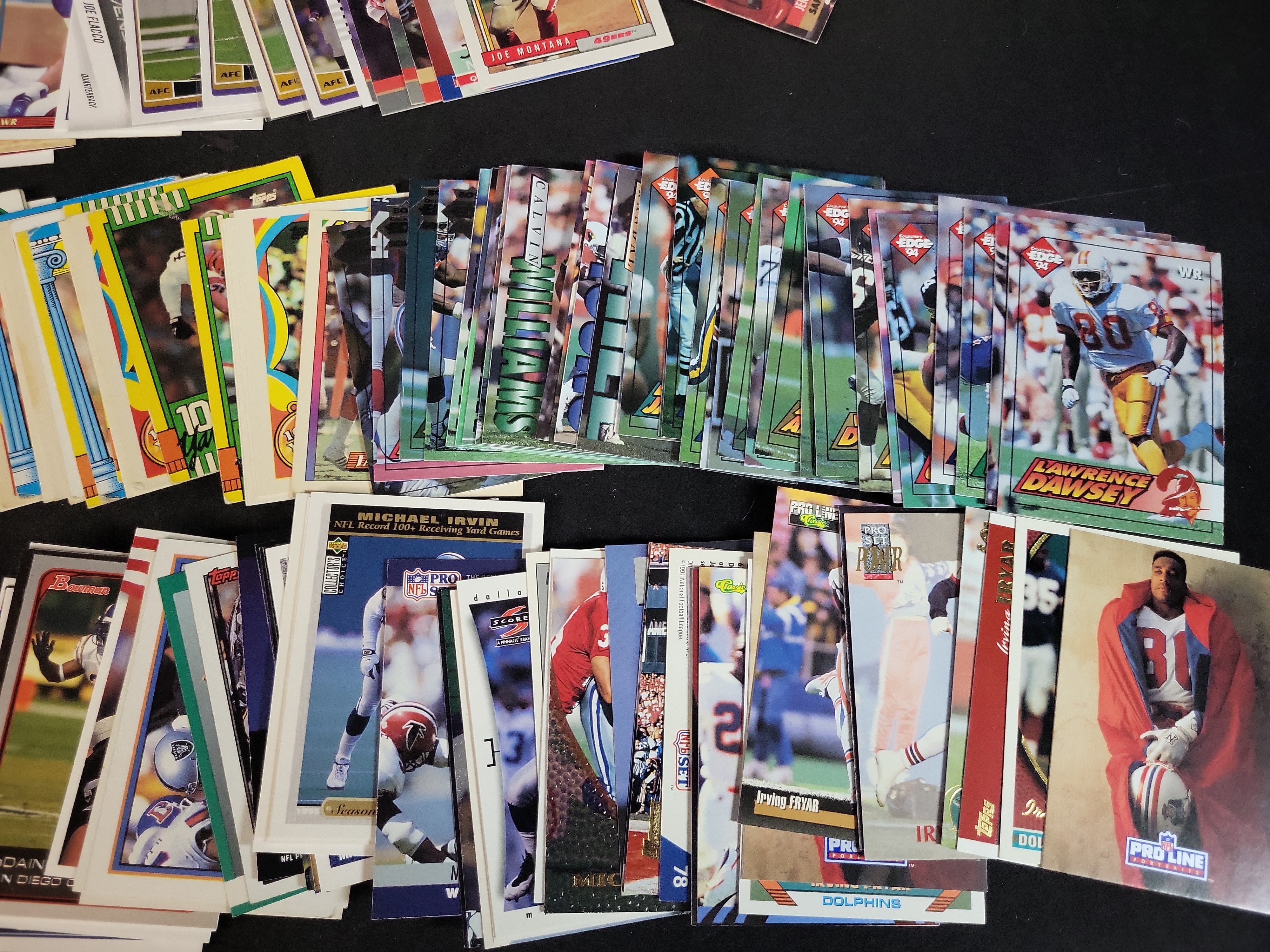 I03652 | An Assortment of Football Trading Cards Late 1980s to Mid 2000s Featuring Joe Montana Bo Jackson and Reggie White