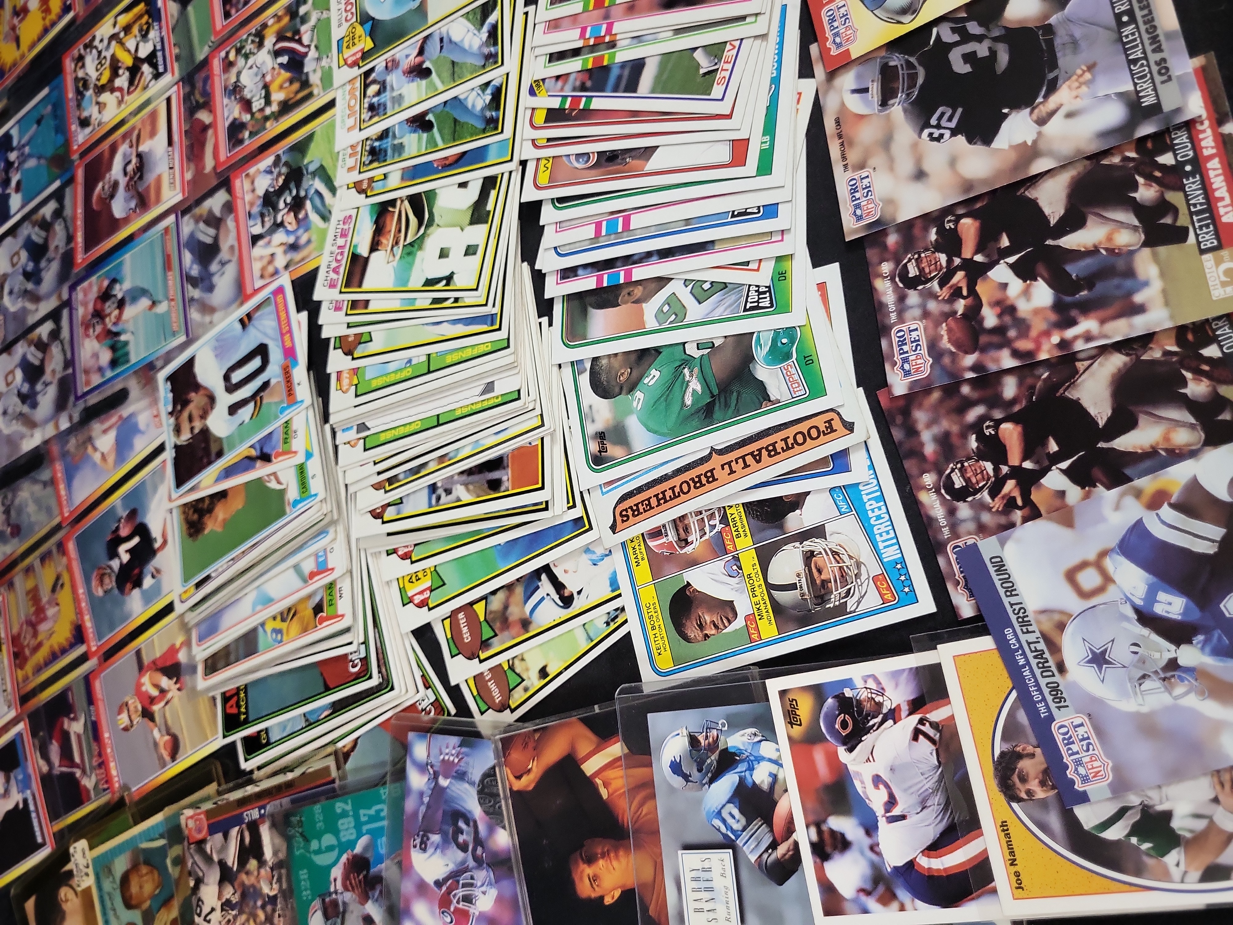 I03871 | A Collection of NFL Trading Cards from the 1970s to 1990s Featuring Rookie Cards and Hall of Famers