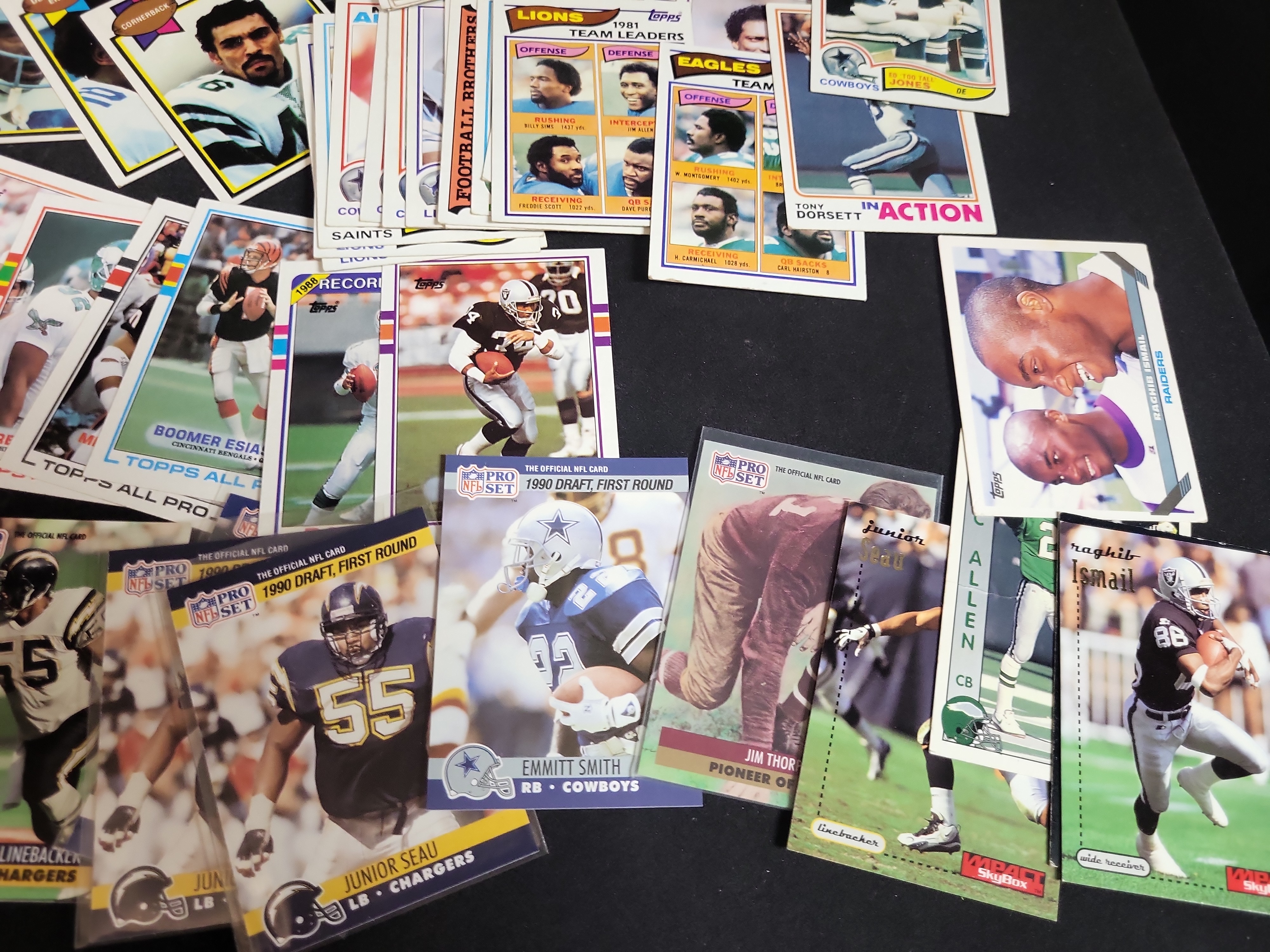 I03871 | A Collection of NFL Trading Cards from the 1970s to 1990s Featuring Rookie Cards and Hall of Famers