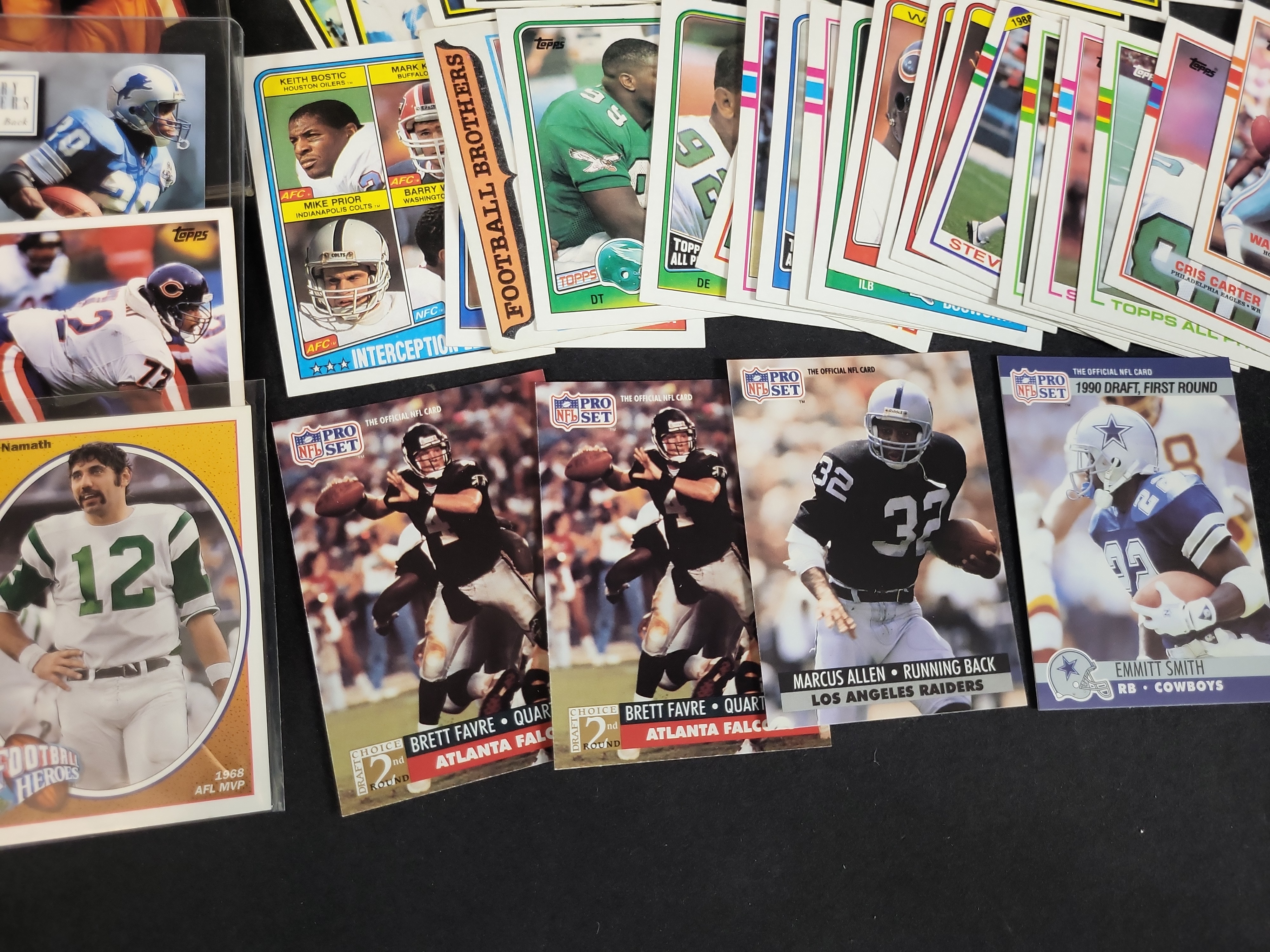 I03871 | A Collection of NFL Trading Cards from the 1970s to 1990s Featuring Rookie Cards and Hall of Famers