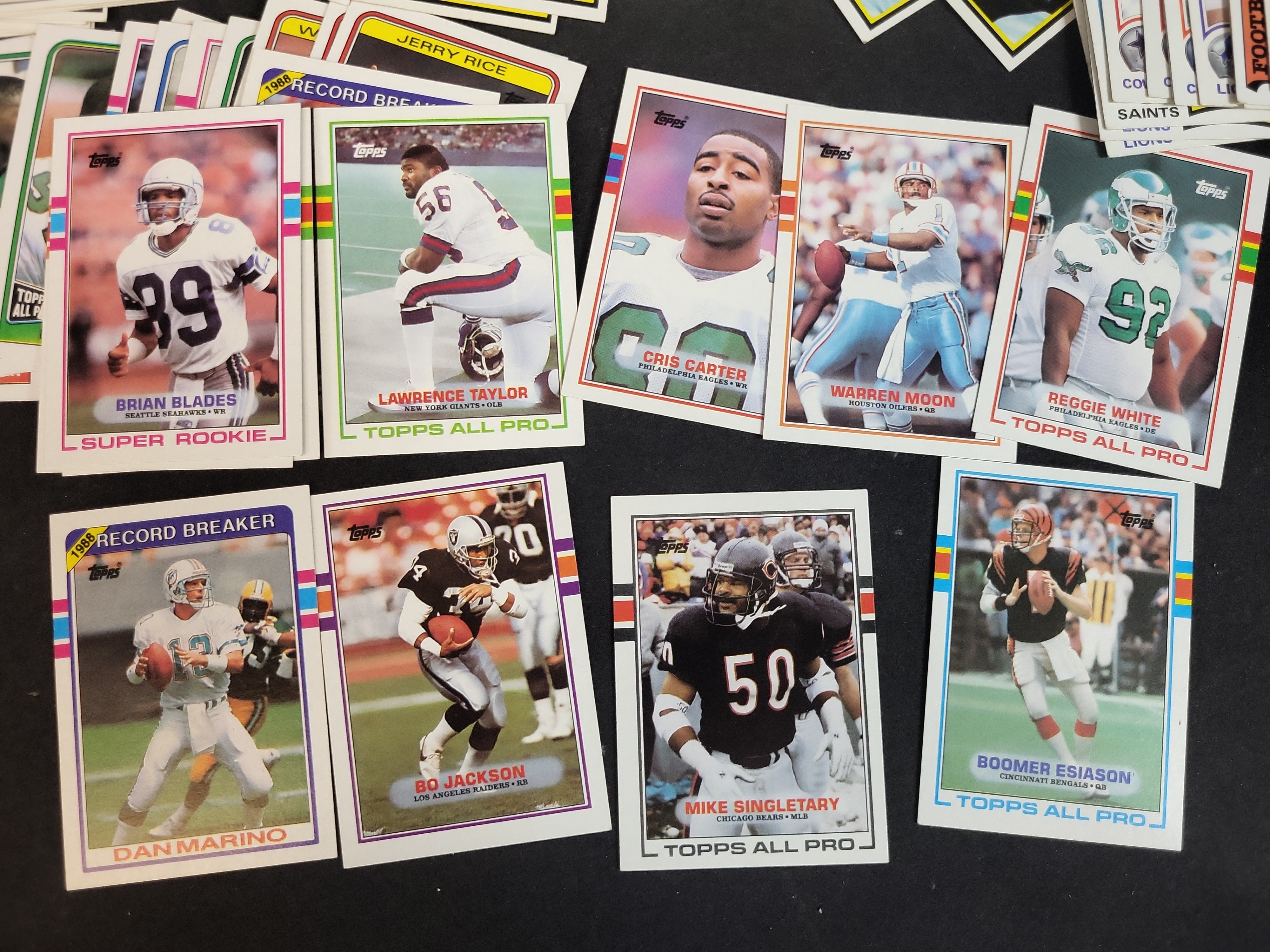 I03871 | A Collection of NFL Trading Cards from the 1970s to 1990s Featuring Rookie Cards and Hall of Famers