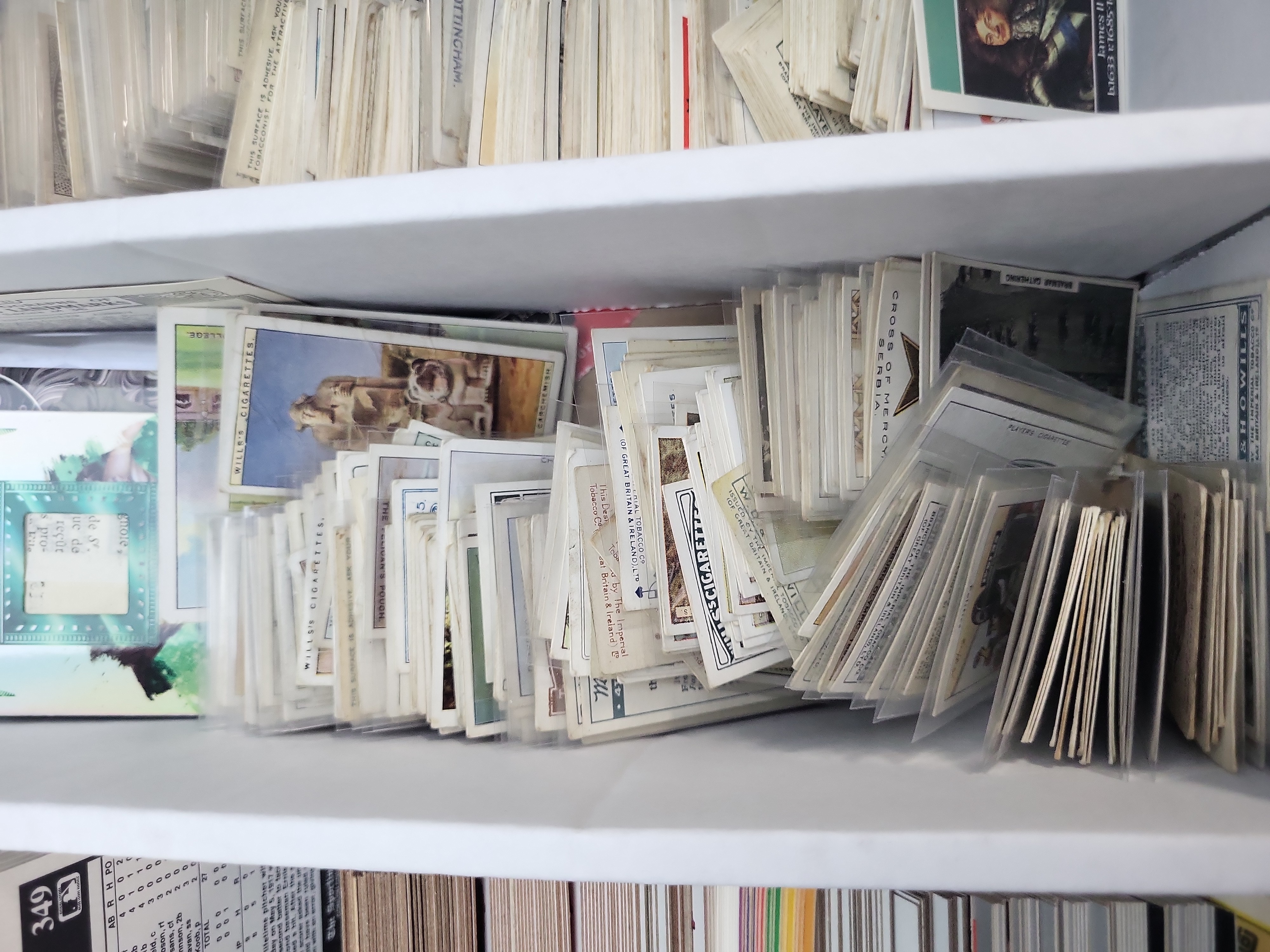 I03319 | An Assortment of Vintage Tobacco Cards, 1980s Baseball Cards, Garbage Pail Kids, and Sports Memorabilia