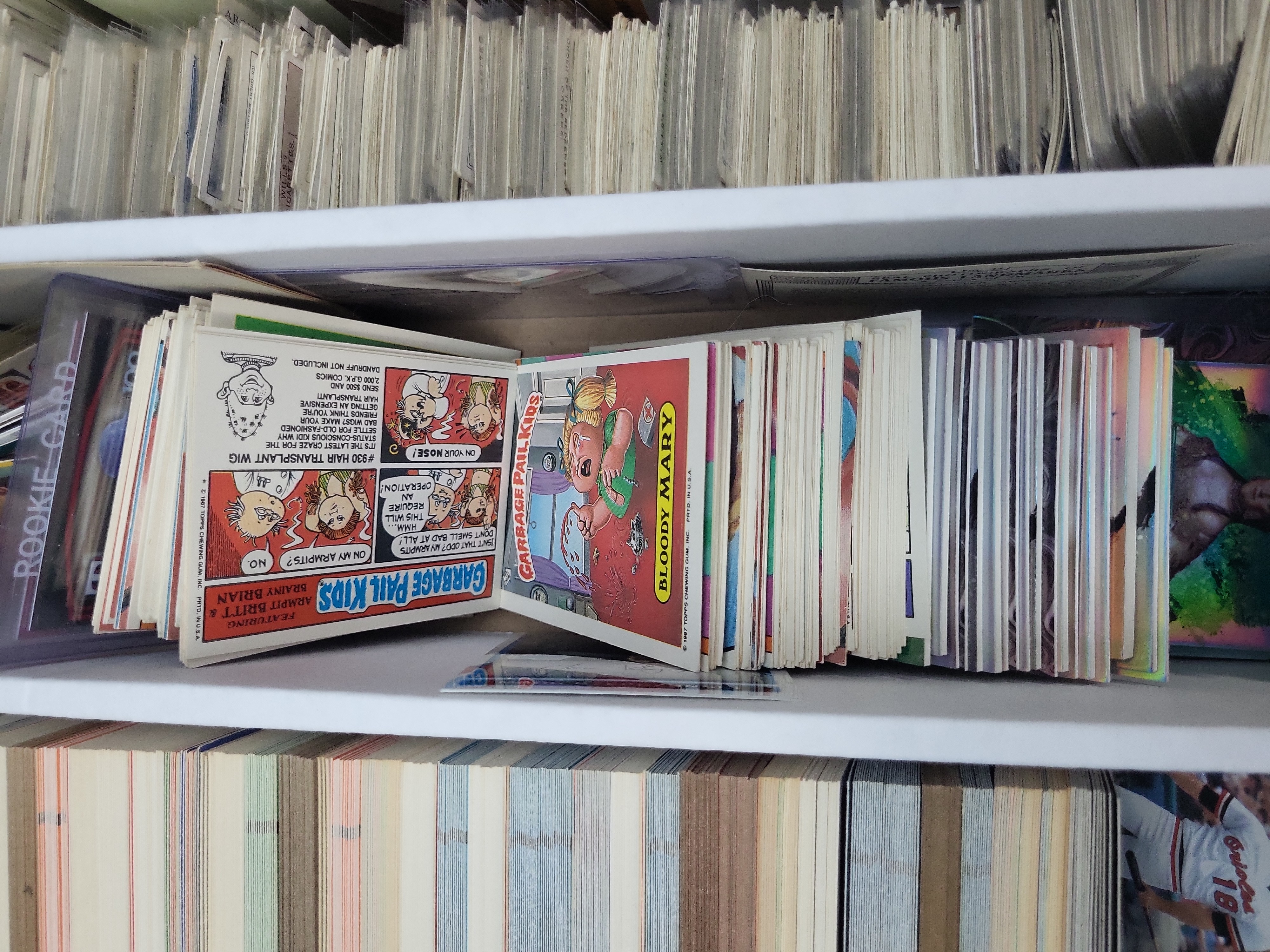 I03319 | An Assortment of Vintage Tobacco Cards, 1980s Baseball Cards, Garbage Pail Kids, and Sports Memorabilia
