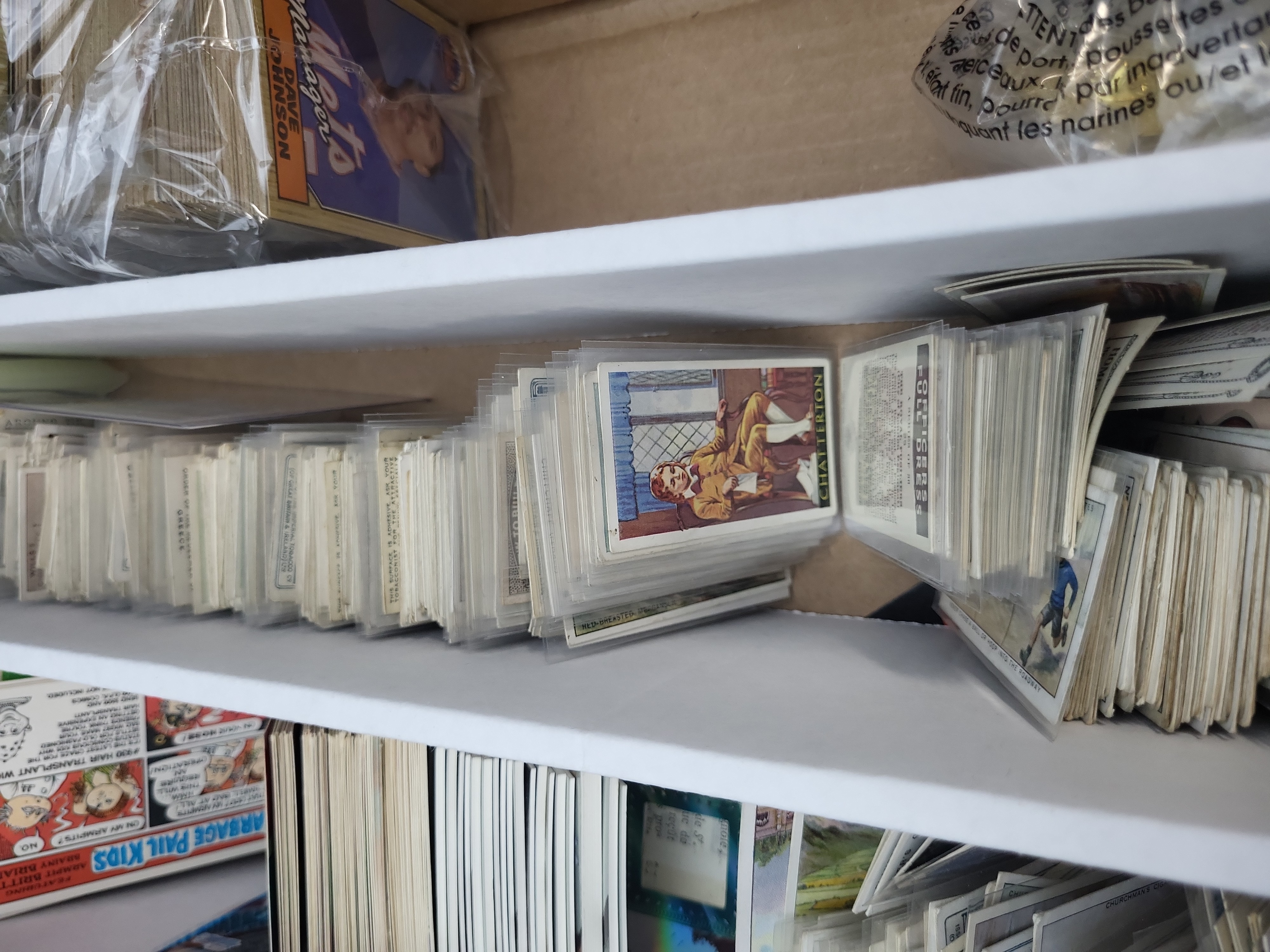I03319 | An Assortment of Vintage Tobacco Cards, 1980s Baseball Cards, Garbage Pail Kids, and Sports Memorabilia