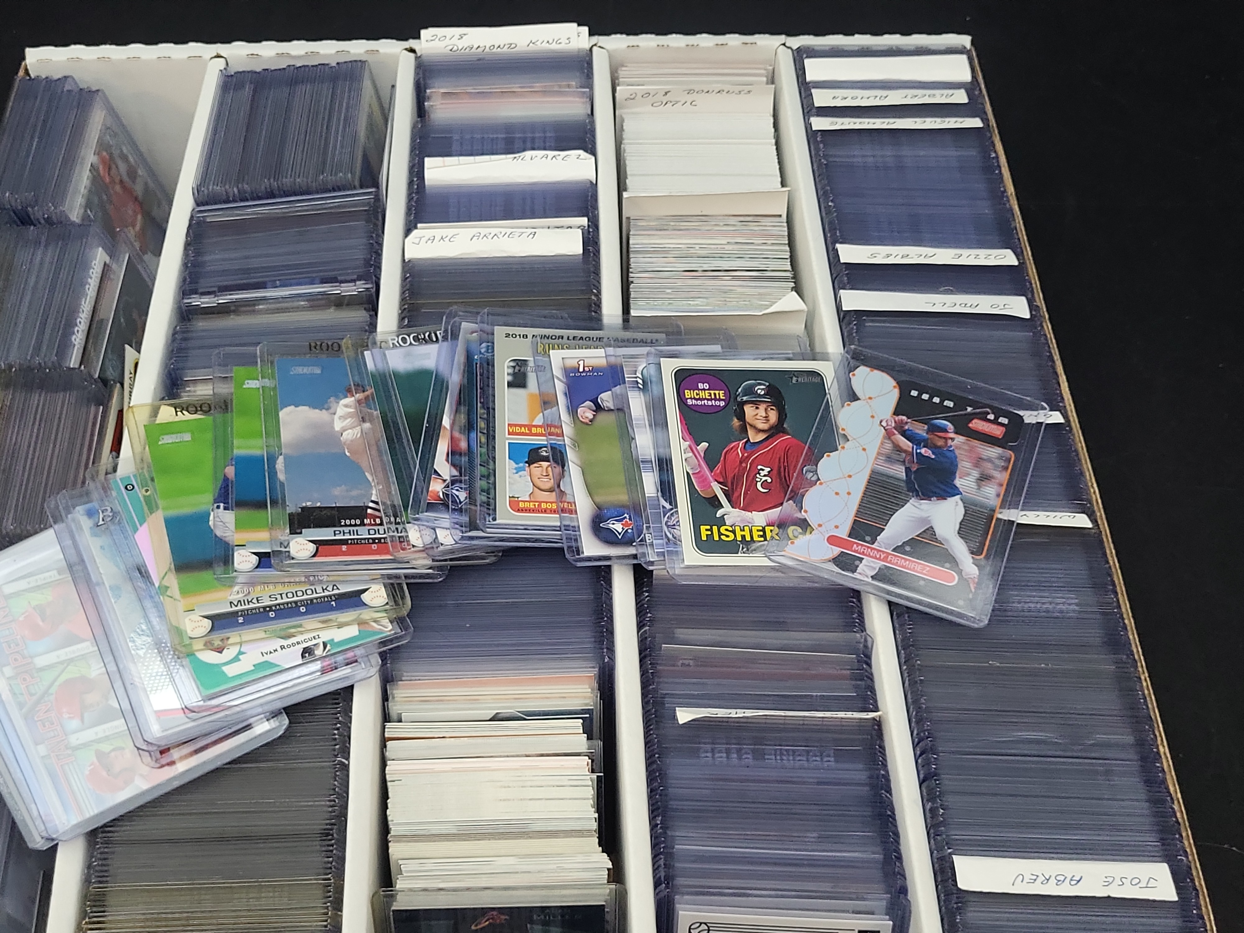 I03321 | An Assortment of Modern Baseball Trading Cards Featuring Rookies, Stars, and Inserts in Protective Top-Loaders