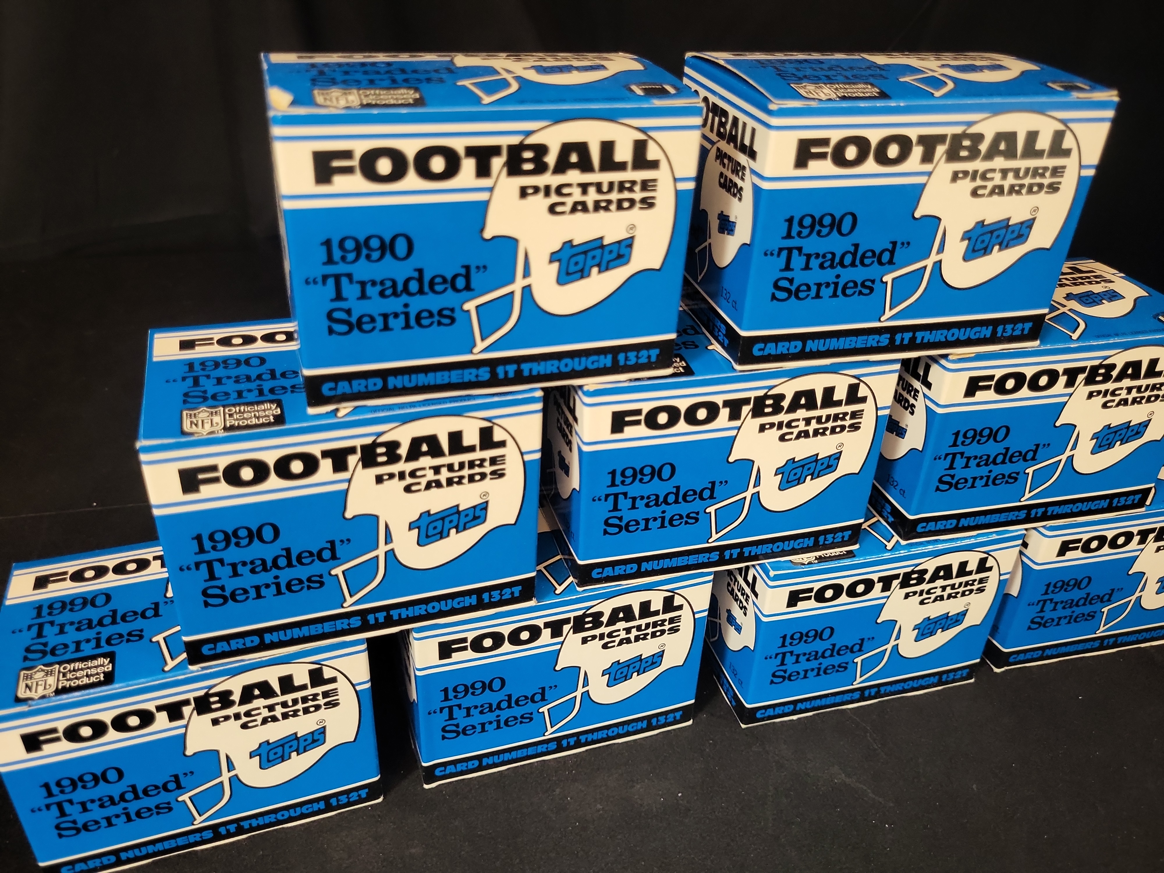I03252 | Group of 9 1990 Topps Football Traded Series Factory Set Boxes