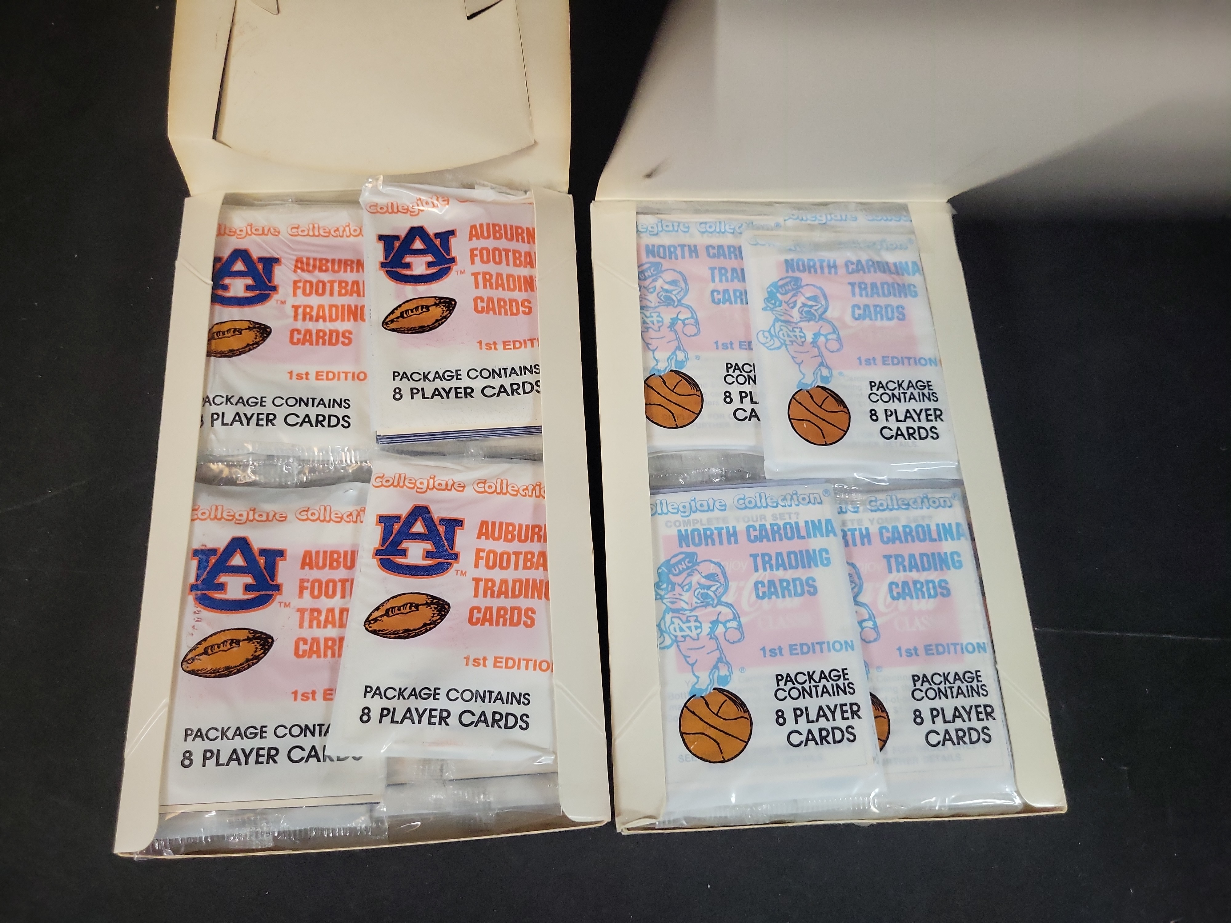 I03229 | Two Collegiate Collection First Edition Trading Card Boxes, Auburn Football and North Carolina Basketball
