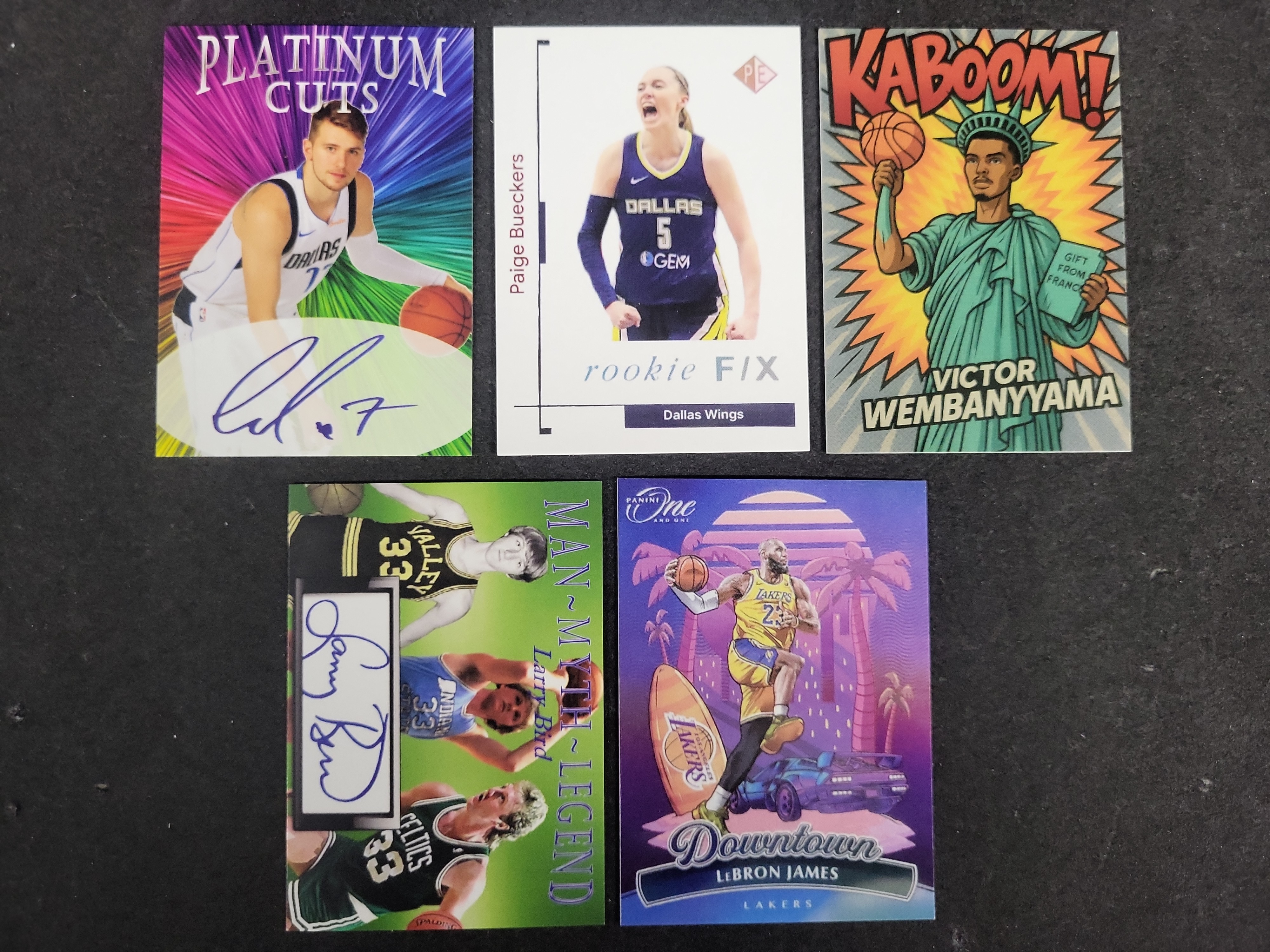 I03596 | An Assortment of Basketball Trading Cards Including LeBron James Downtown and Victor Wembanyama Custom Art Cards