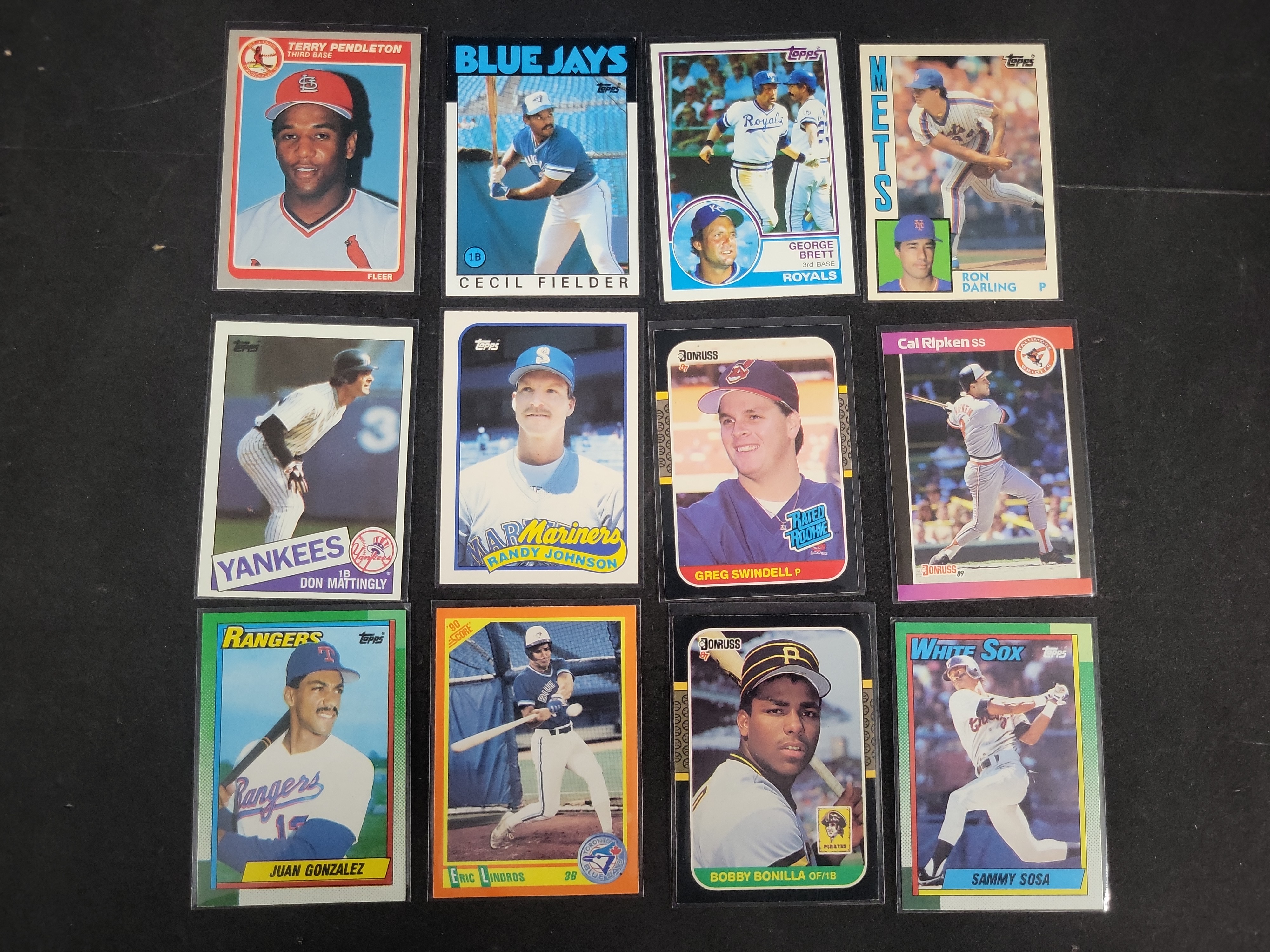 I03164 | A Collection of 12 Vintage Baseball and Crossover Trading Cards Including Rookies and Hall of Famers 1983-1990