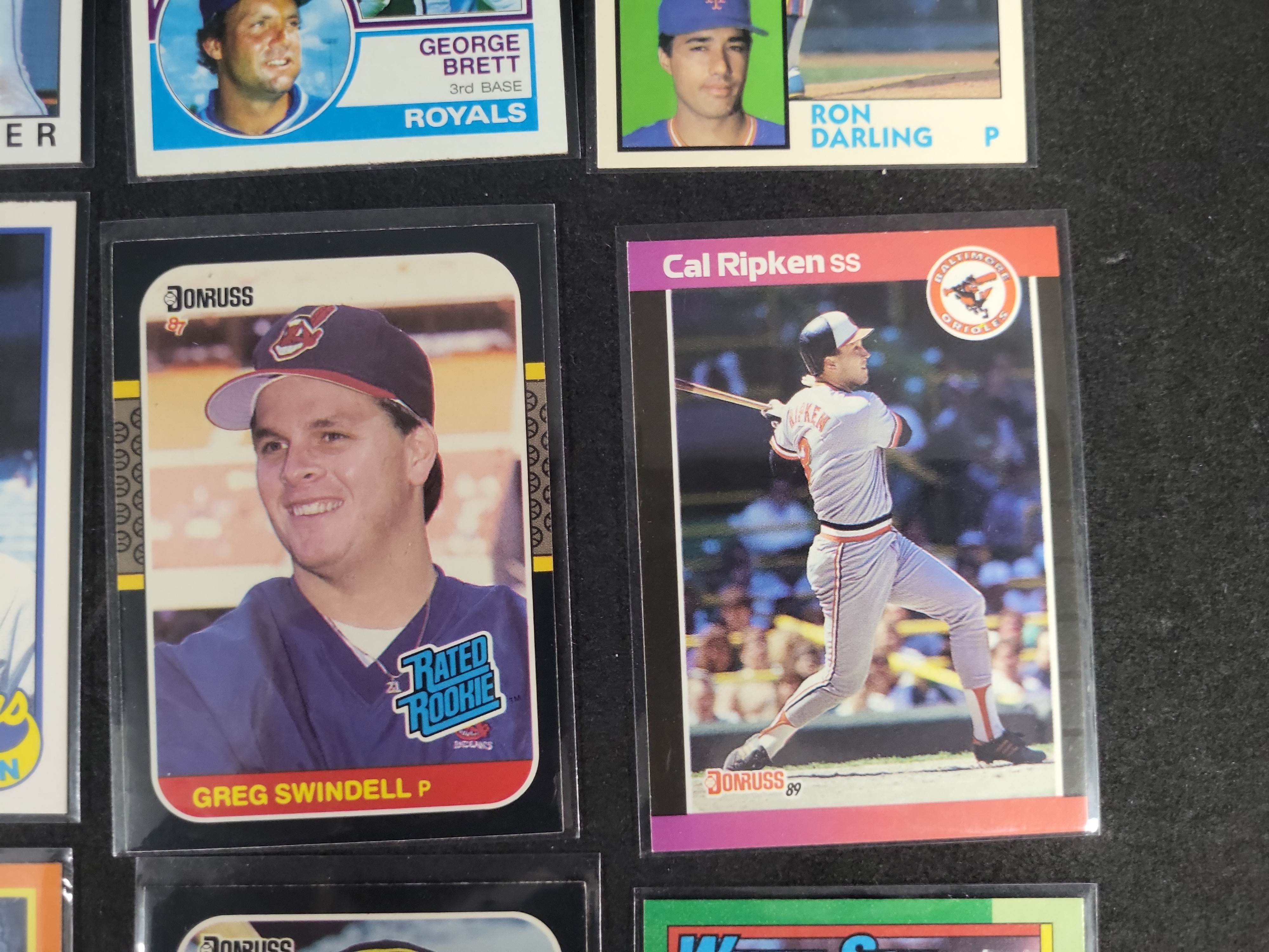 I03164 | A Collection of 12 Vintage Baseball and Crossover Trading Cards Including Rookies and Hall of Famers 1983-1990