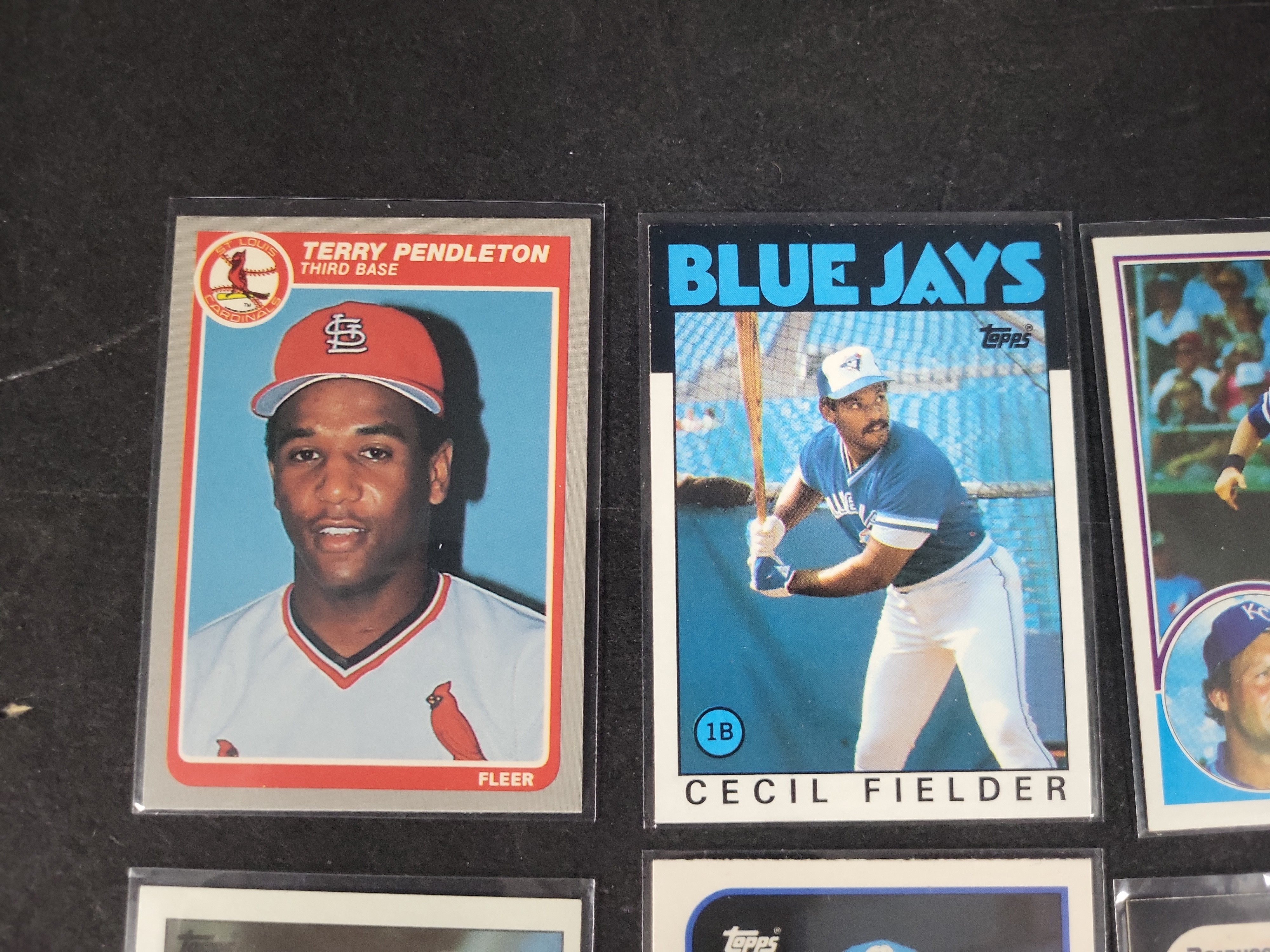 I03164 | A Collection of 12 Vintage Baseball and Crossover Trading Cards Including Rookies and Hall of Famers 1983-1990