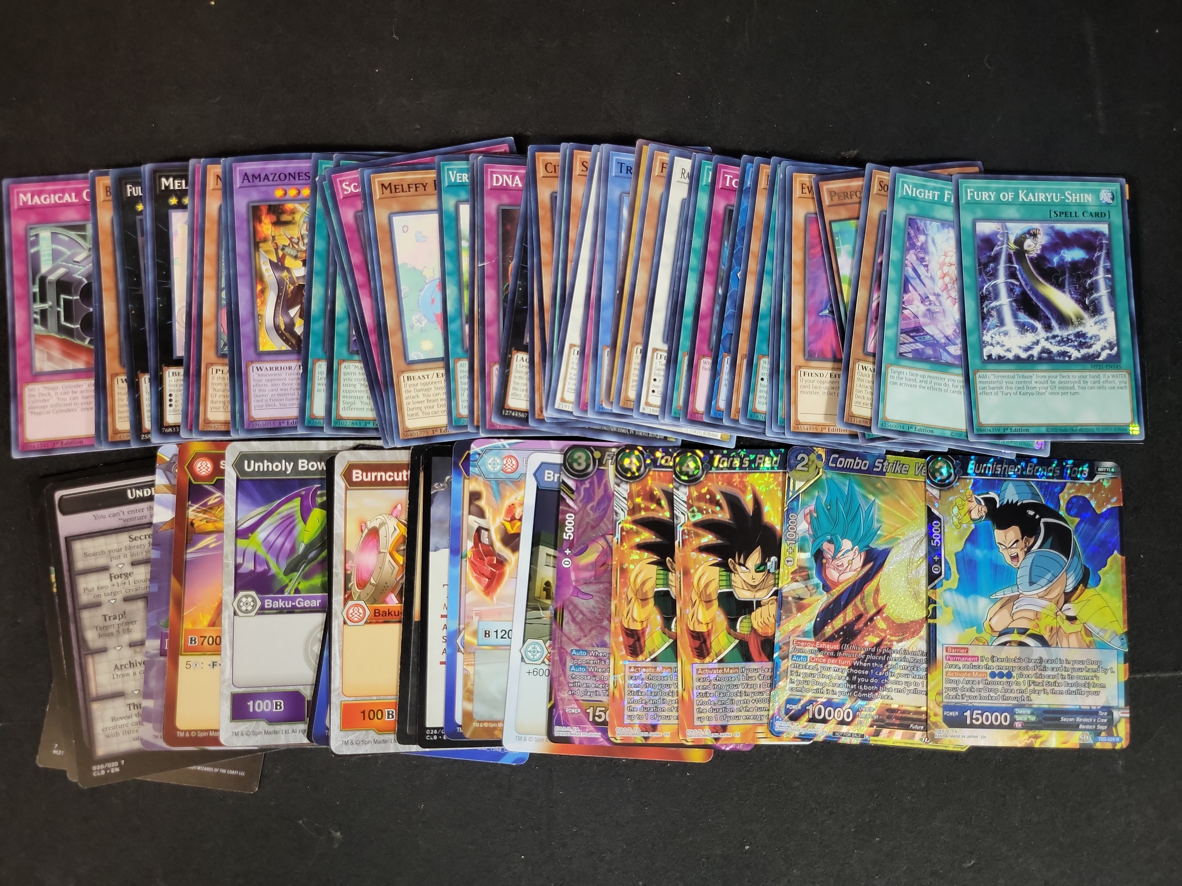 I03936 | An Assortment of Trading Cards Including Dragon Ball Super, Yu-Gi-Oh!, Bakugan, and Magic: The Gathering